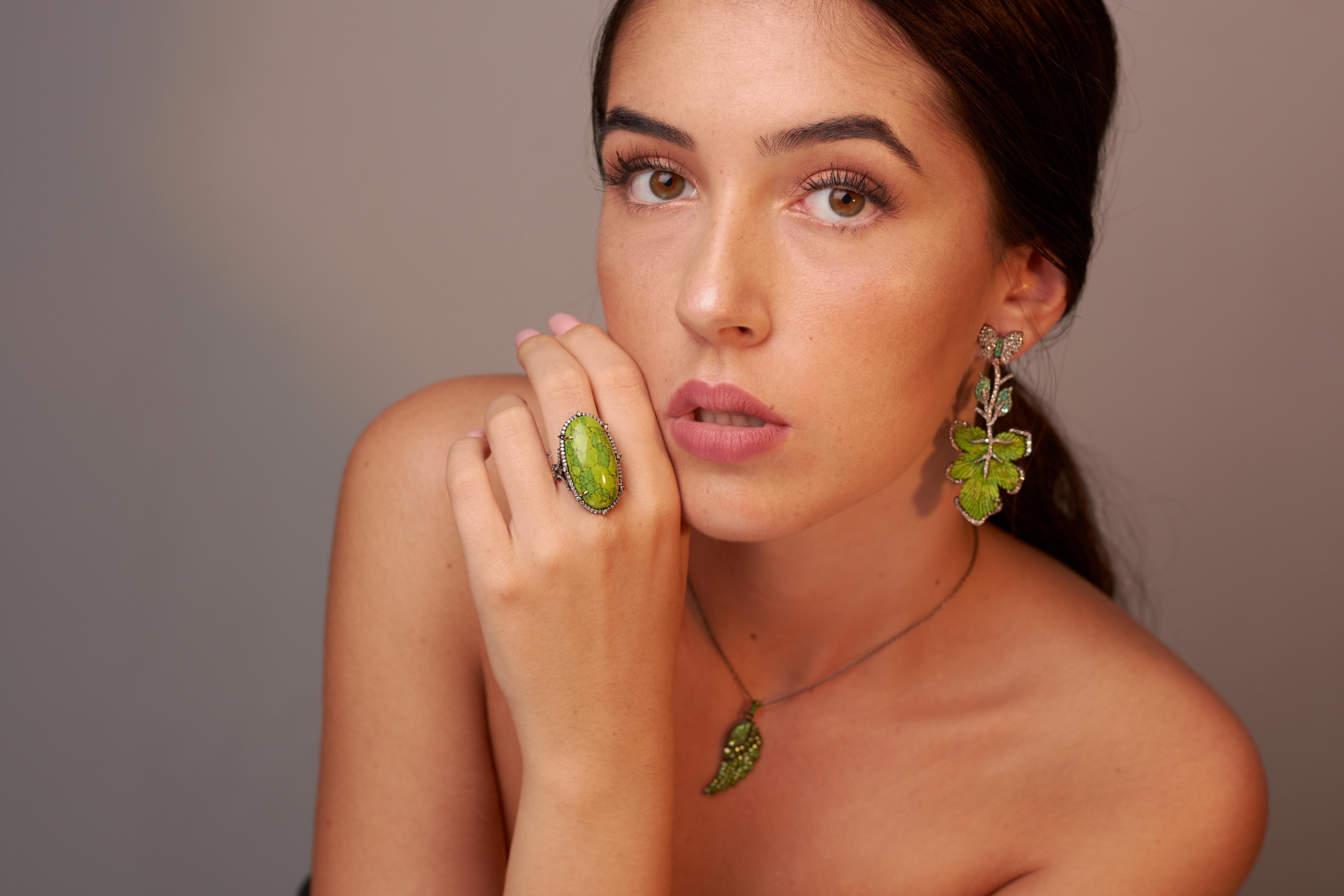 These stunning earrings are thoughtfully and meticulously crafted in 18-karat gold and sterling silver. It is set in 39.64 carats turquoise, .84 carats emerald and 2.42 carats of diamonds.

FOLLOW  MEGHNA JEWELS storefront to view the latest