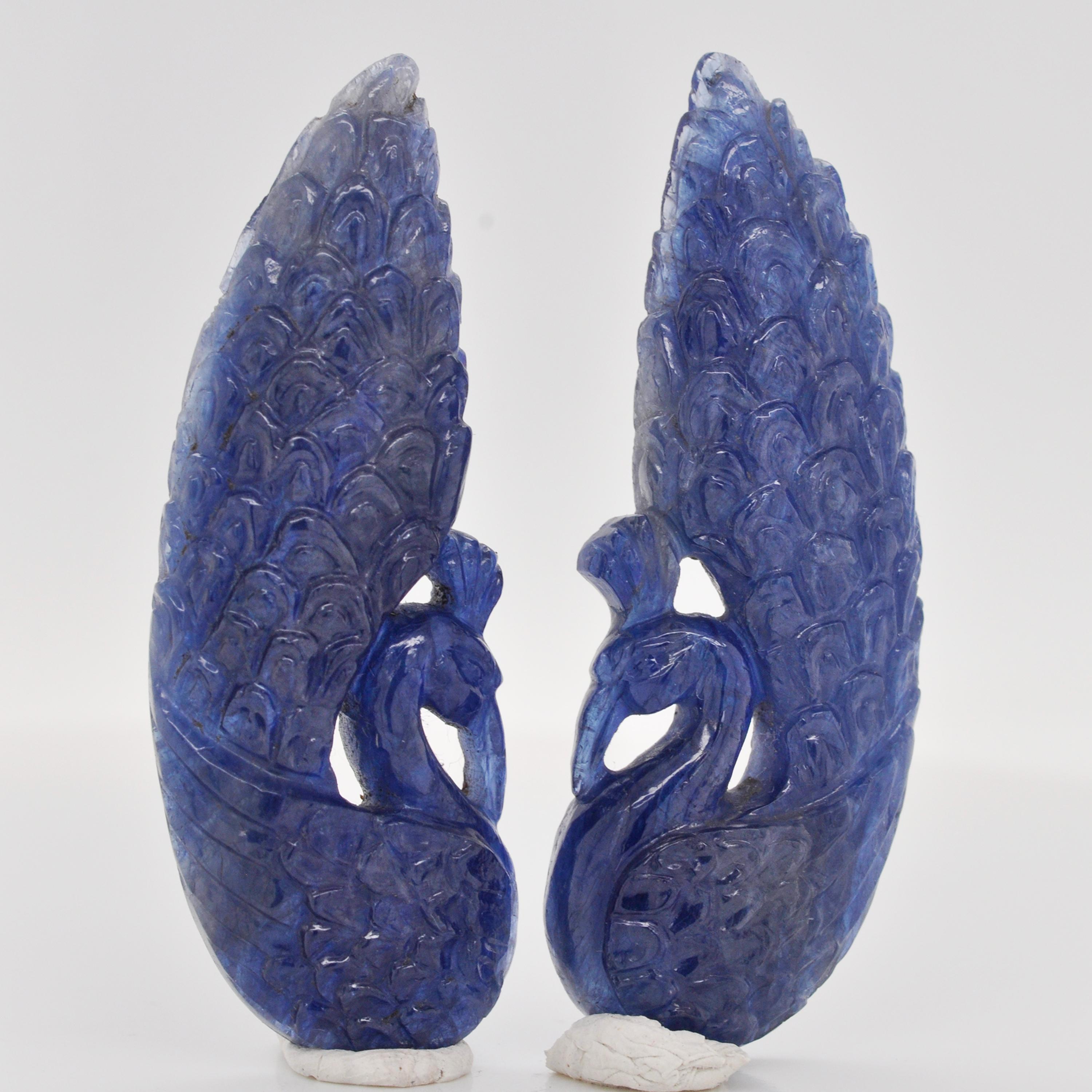 75.93 carats natural blue sapphire hand-carved peacock loose gemstone carvings for dangling earrings.

This pair of peacock carving on natural blue sapphire is hand-carved by our expert lapidary artist in jaipur which transforms raw stones into