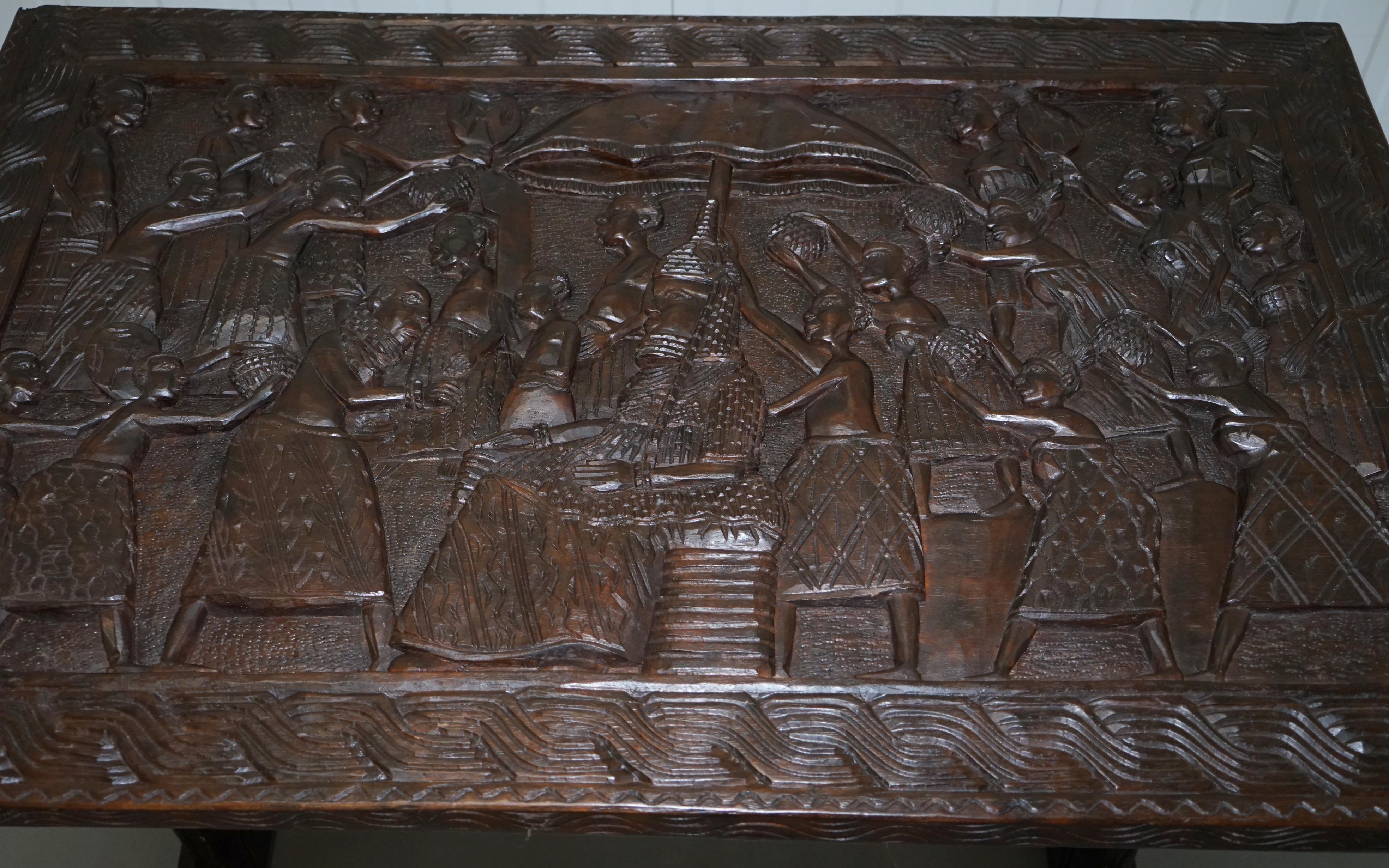 Hand-Carved African Dining Table with Decorative Benin Figures Matching Chairs In Distressed Condition In West Sussex, Pulborough