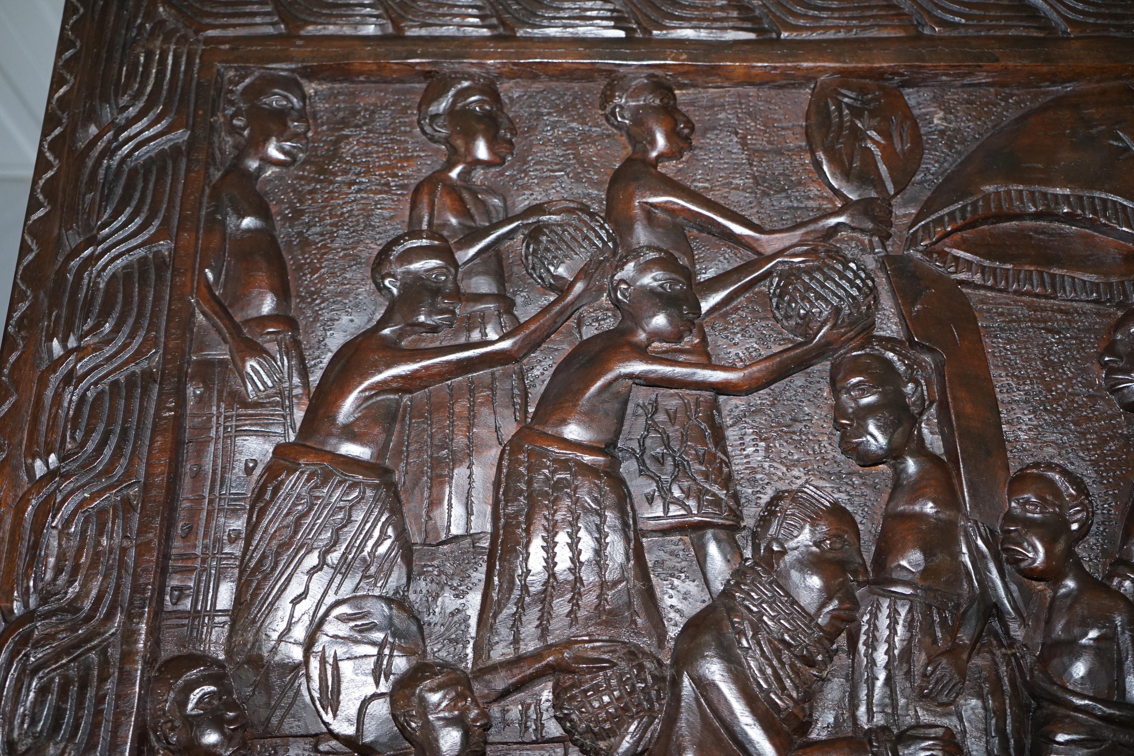 Wood Hand-Carved African Dining Table with Decorative Benin Figures Matching Chairs
