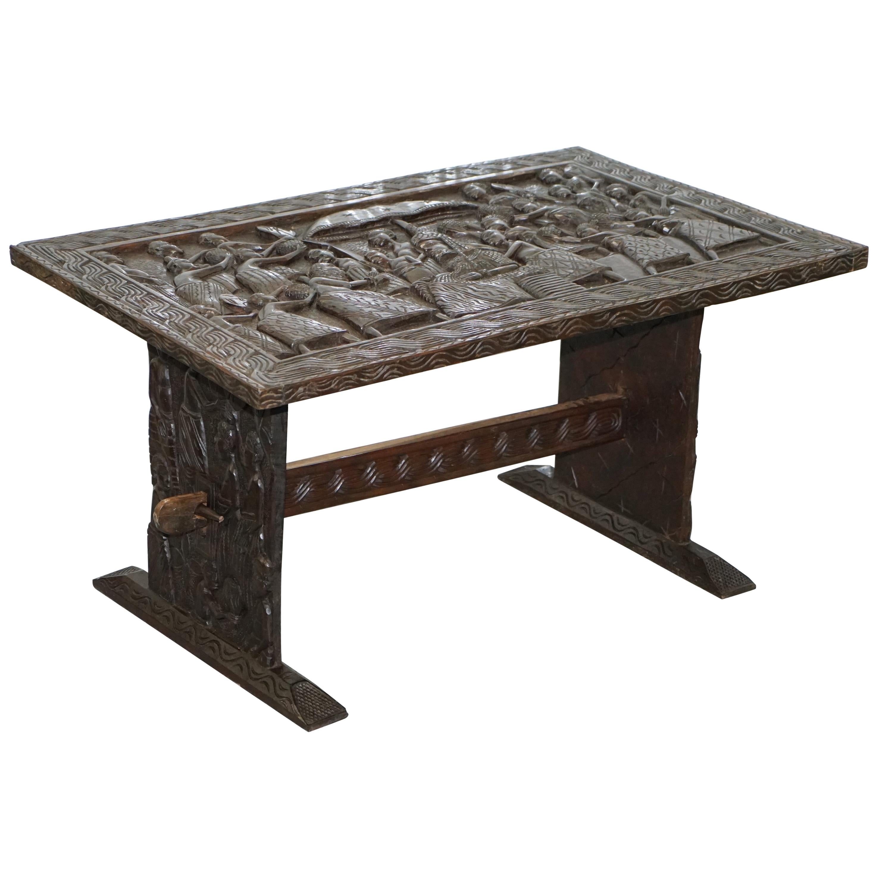 Hand-Carved African Dining Table with Decorative Benin Figures Matching Chairs