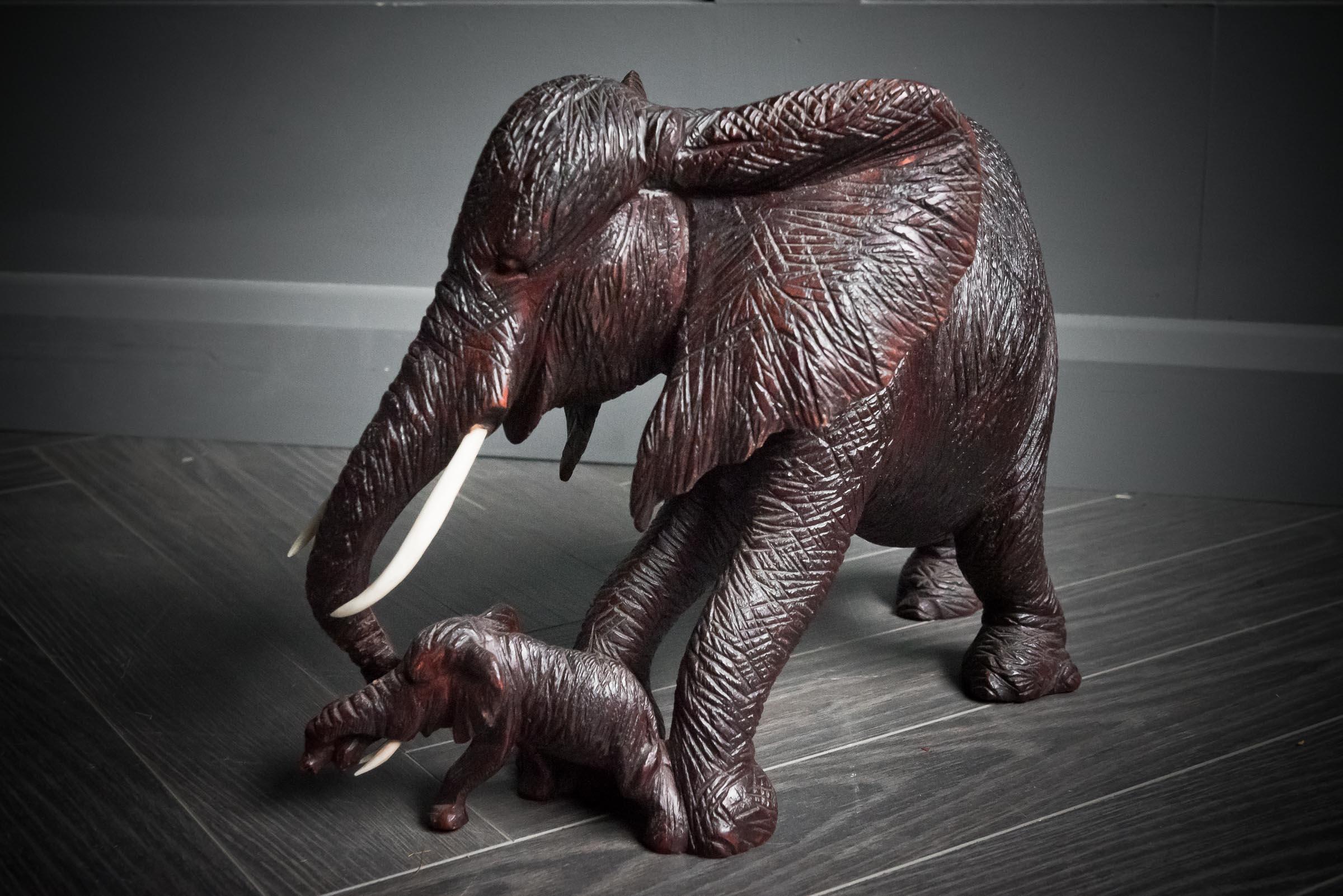 Hand carved african elephant with baby.