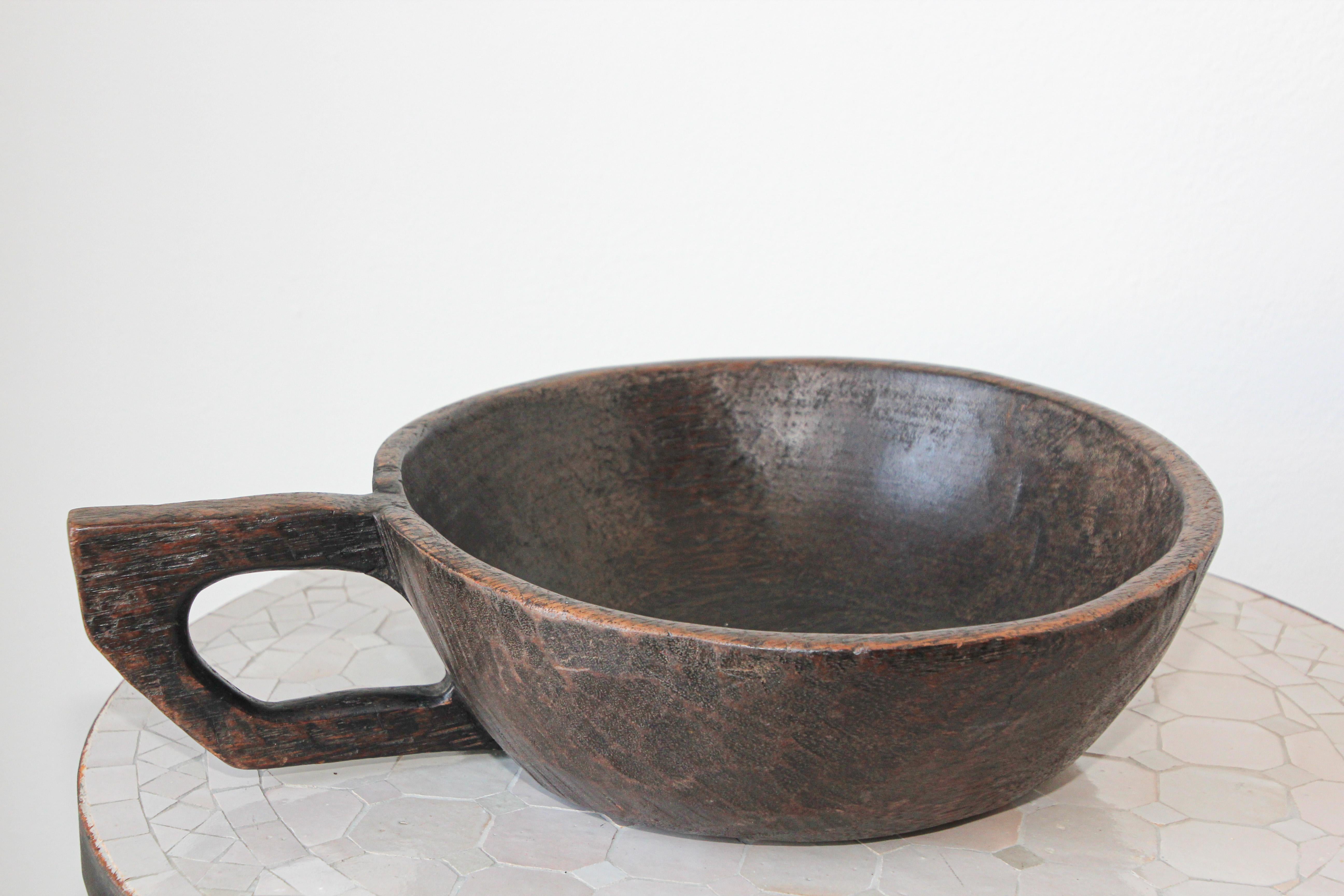 Hand hewn and hand carved African Ethiopian wooden bowl with handle.
Original large vintage Ethiopian tribal wood bowl hand carved bowl from a unique piece of wood
Exceptionally large hand crafted and large sculptural wood centerpiece bowl with