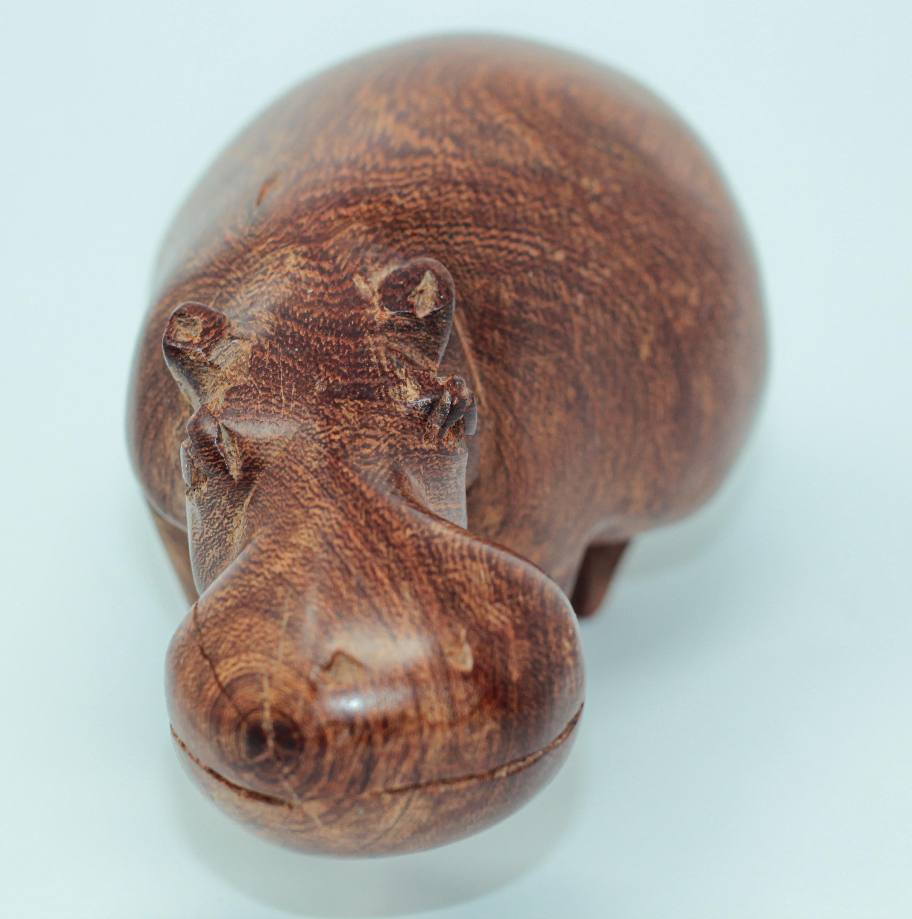 Vintage hand carved wooden teak African hippopotamus sculpture.
Very nice handmade, hand carved on one piece of wood.
The piece is carved from a single piece of solid teak it is in good condition and looks great in any space.