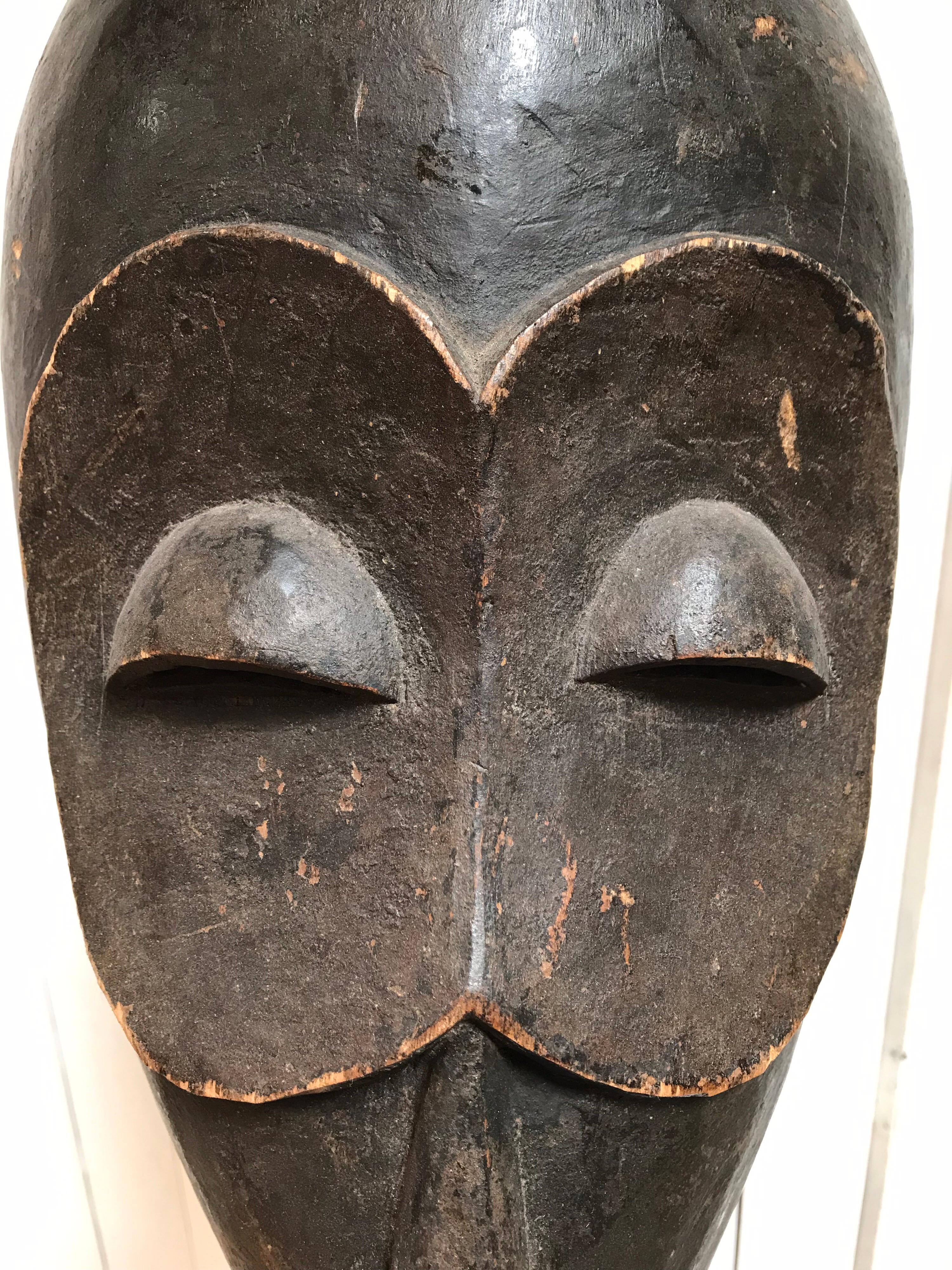 Hand-Carved Hand Carved African Wooden Mask on Stand