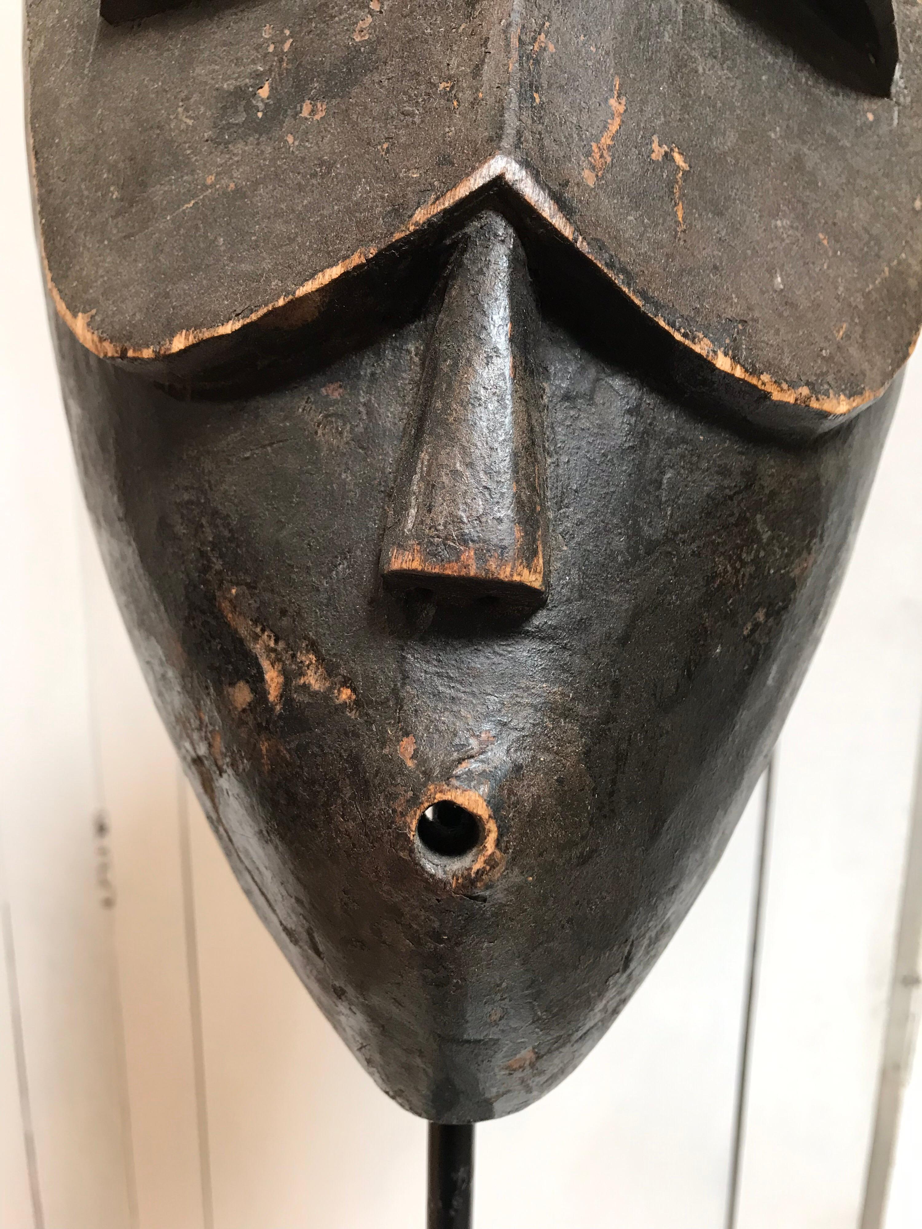 Hand Carved African Wooden Mask on Stand In Good Condition In Dallas, TX