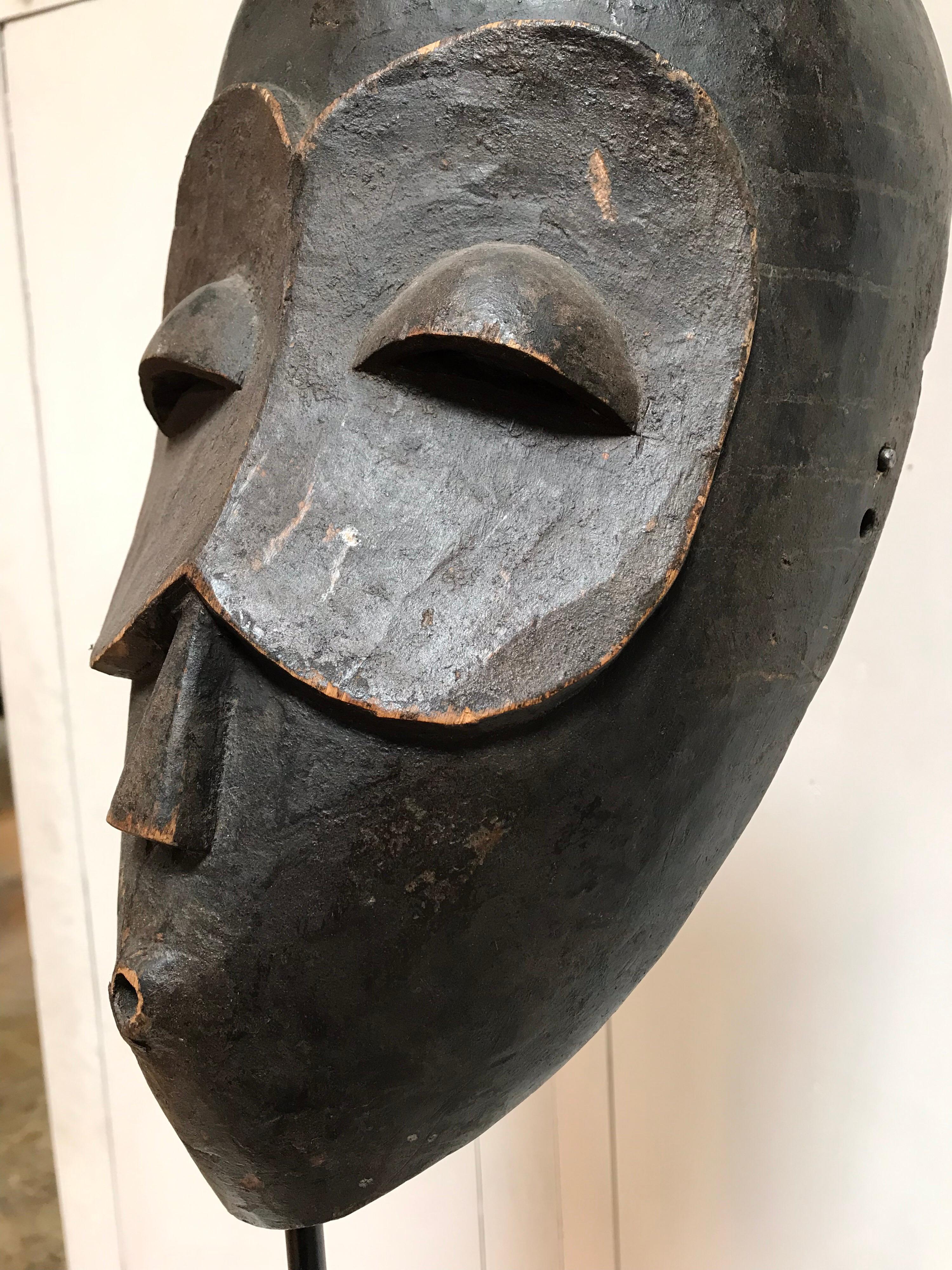 Mid-20th Century Hand Carved African Wooden Mask on Stand