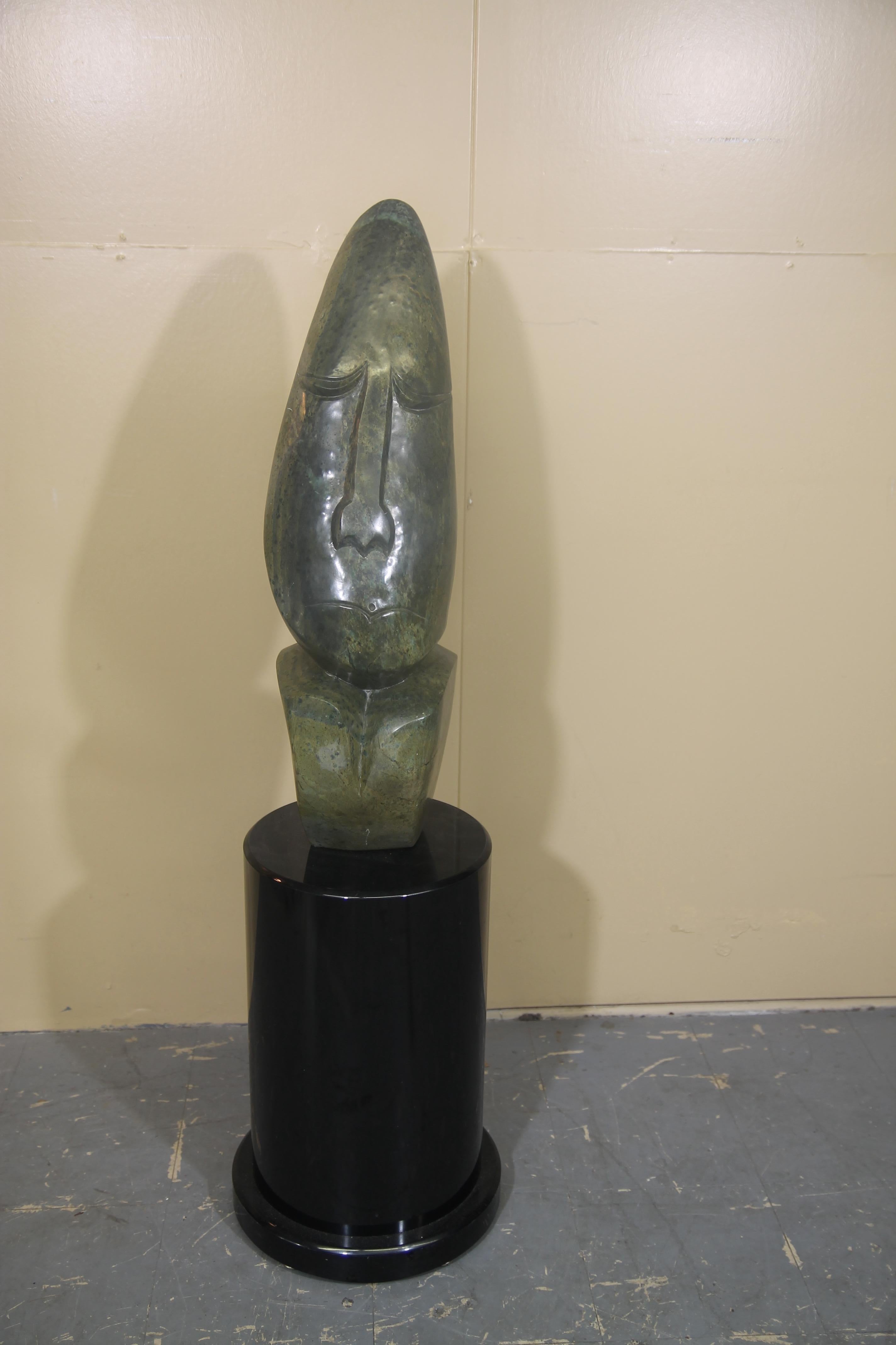 Wonderful hand carved African Alabaster Sculpture on black pedestal. Overall height including the base is 43 inches.