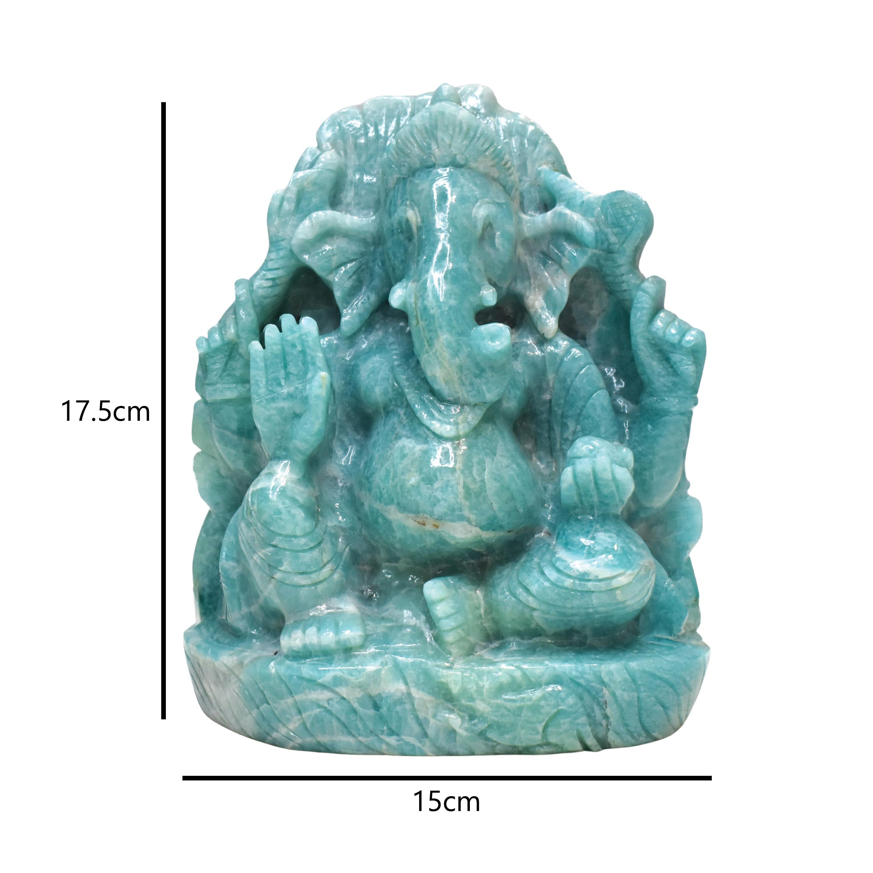 Radiating vibrant energy and intricate craftsmanship, this Lord Ganesha idol is hand-carved from natural Amazonite, a gemstone revered for its calming properties and soothing turquoise-green hues. Measuring 17.5 cm in height and 15 cm in width, this