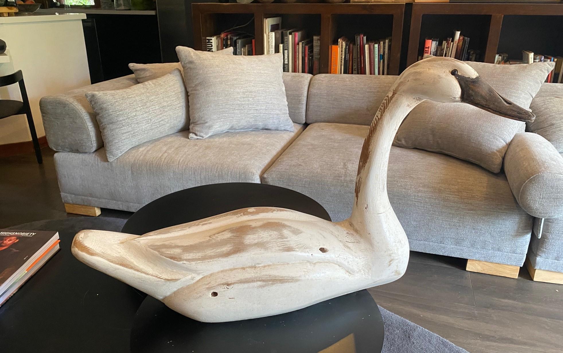 A fantastic, large hand-carved and painted wood swan decoy.  This piece has a wonderful classic shape, bright white color, and texture.  

From an impressive Los Angeles vintage duck and antique swan decoy collection.  

Swan decoys are fairly