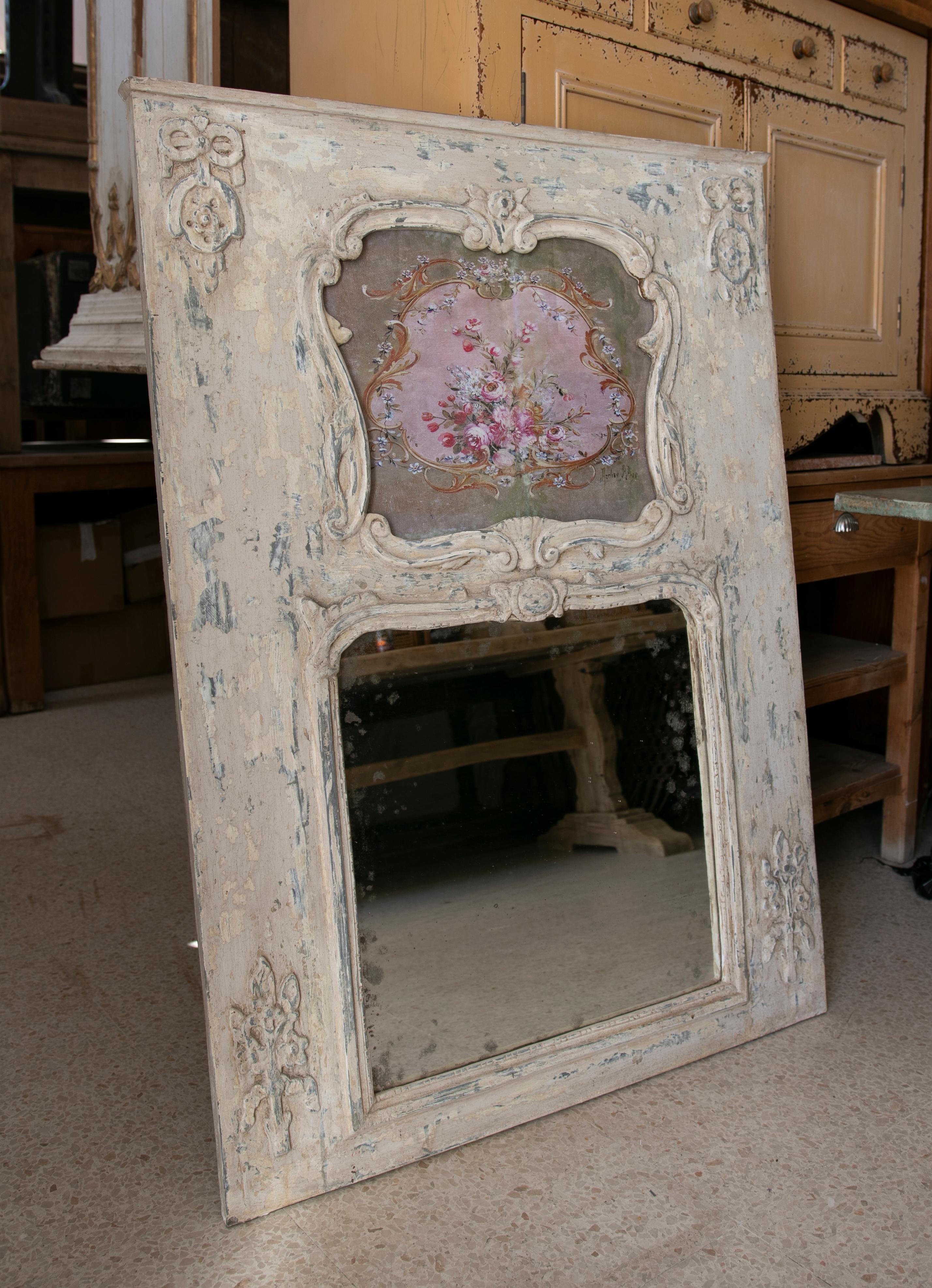 Hand-carved and Polychromed wooden Trumeau wall mirror.