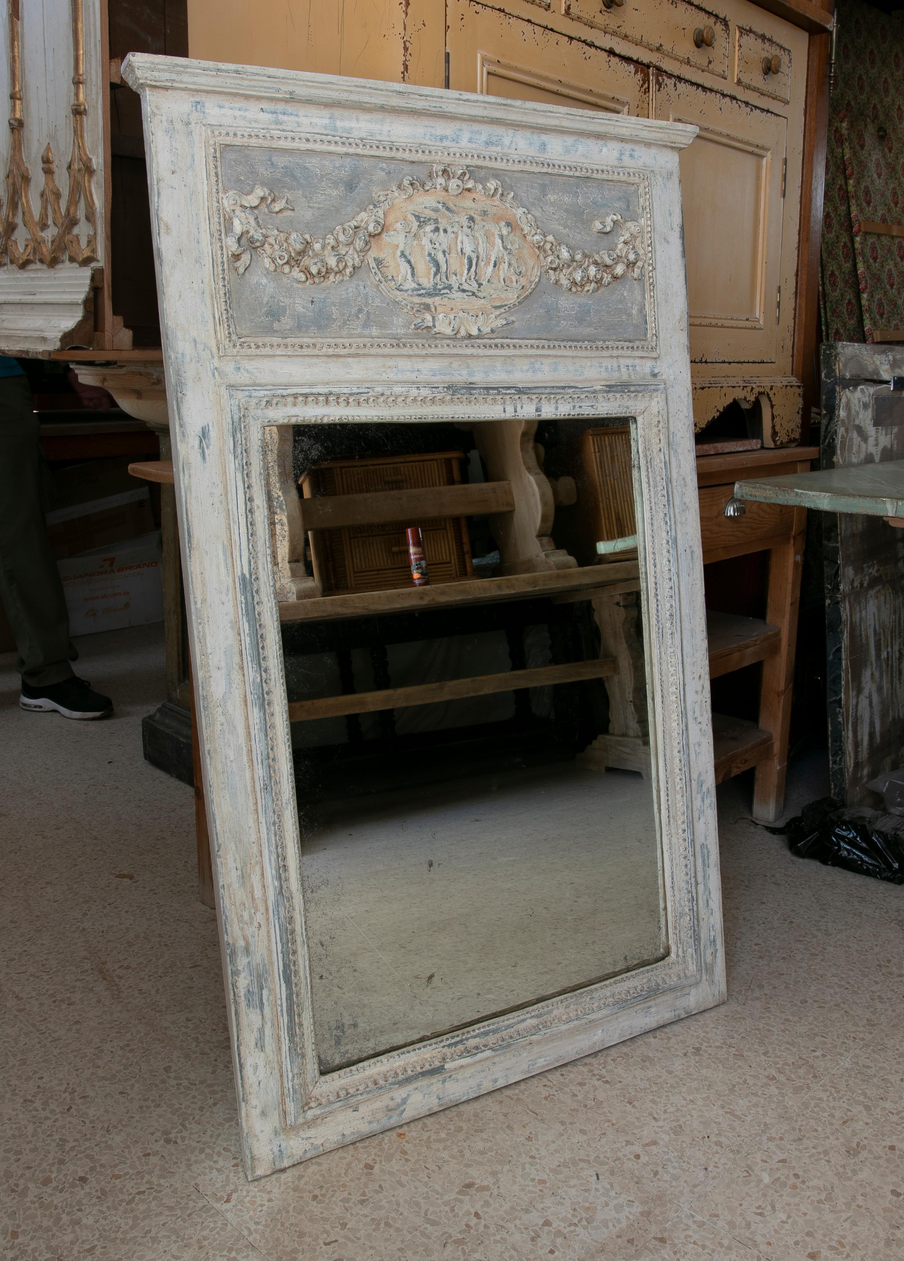 Hand-Carved and Polychromed wooden Trumeau wall mirror.