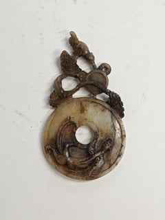 Hand-carved Antique bi pendant in jade. China 19th Century