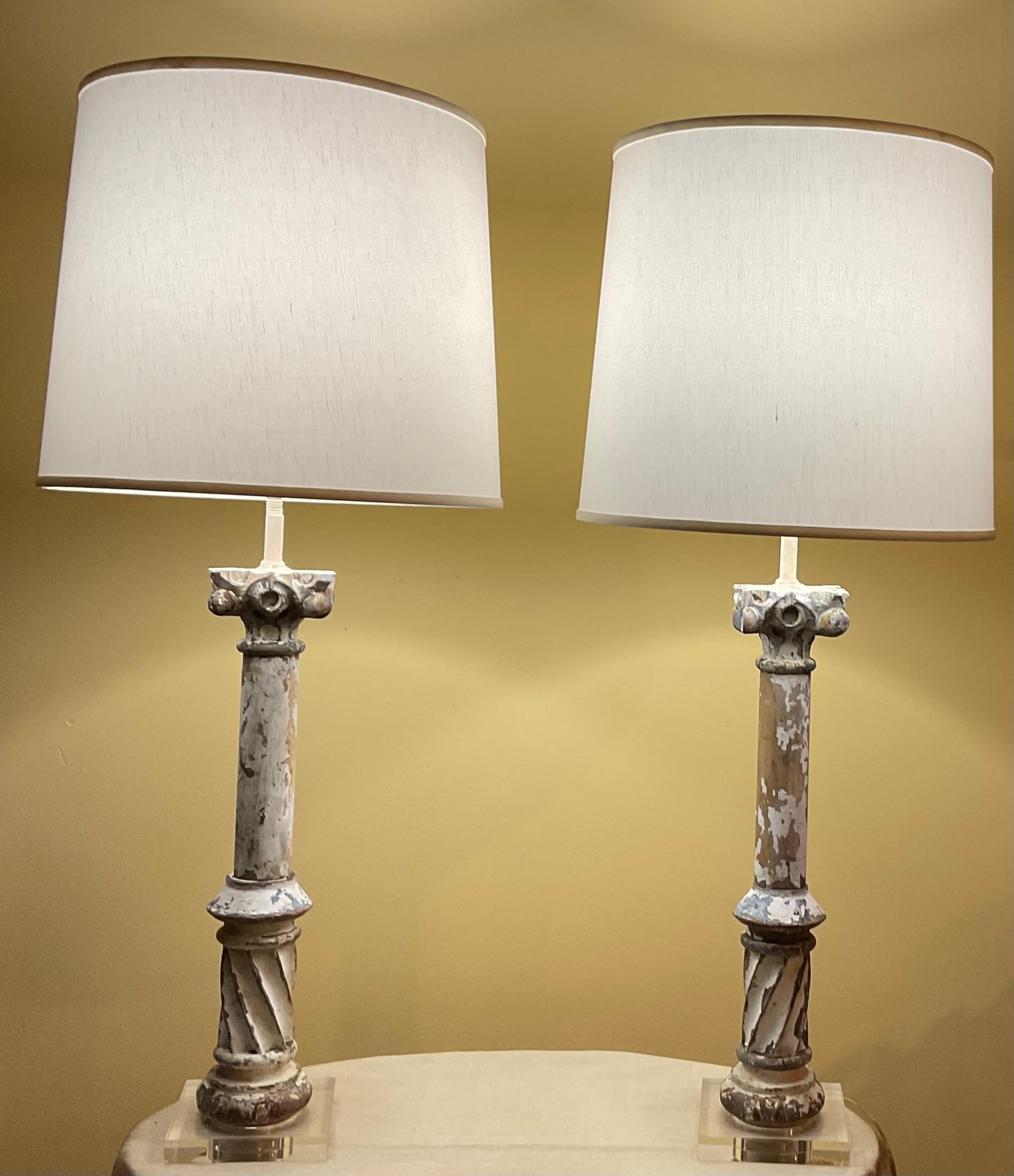 
This elegant pair of antique wood column table lamps , offers a unique blend of history, artistry, and functional beauty. Hand carved and crafted from solid wood, each lamp features a fluted column base that showcases intricate detailing and a rich