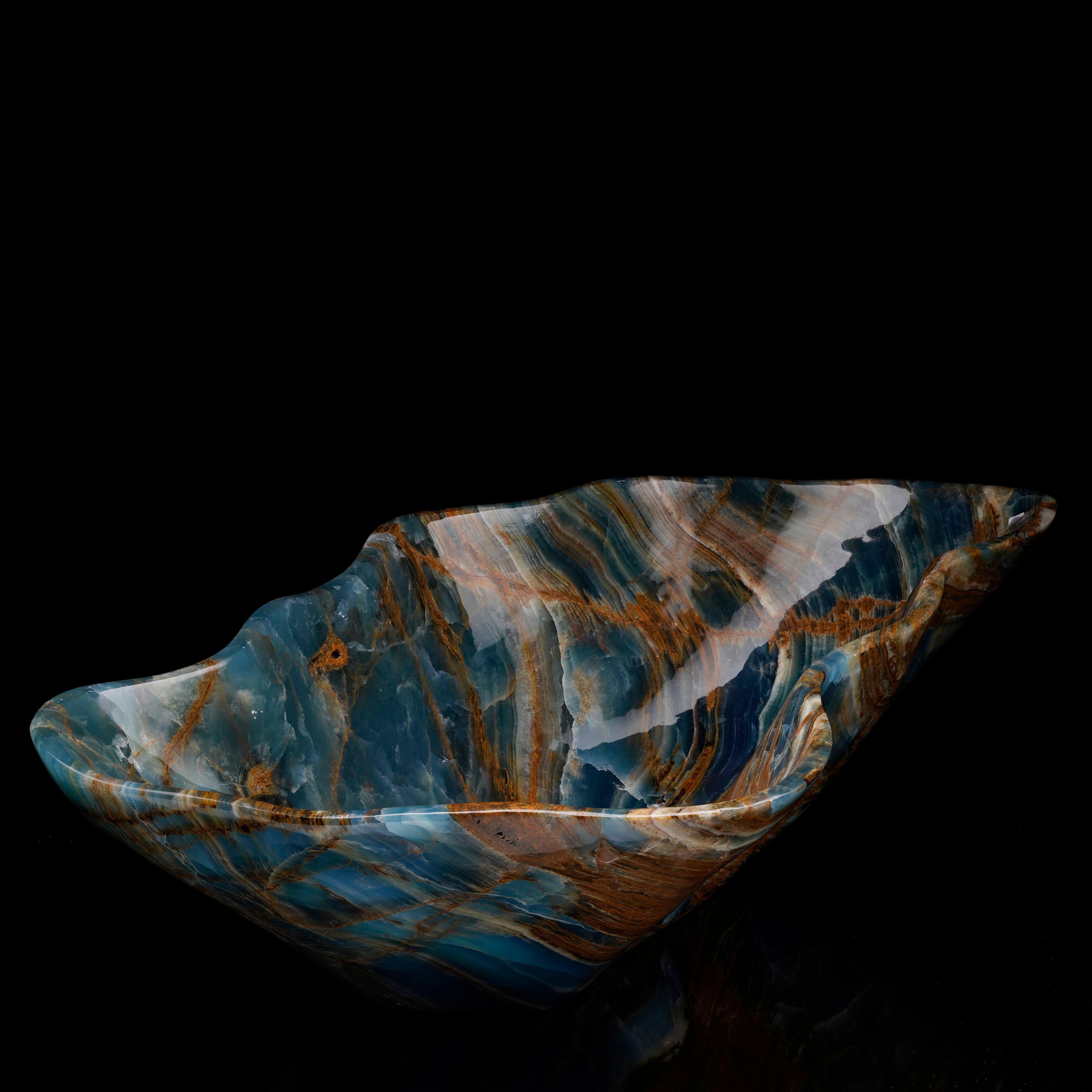 Blue onyx is a rare blue variety of onyx crystal and Argentina is known for producing the highest quality specimens. This deeply pigmented, beautifully veined 13 lb. piece out of Argentina has been hand-carved and hand-polished into a large and