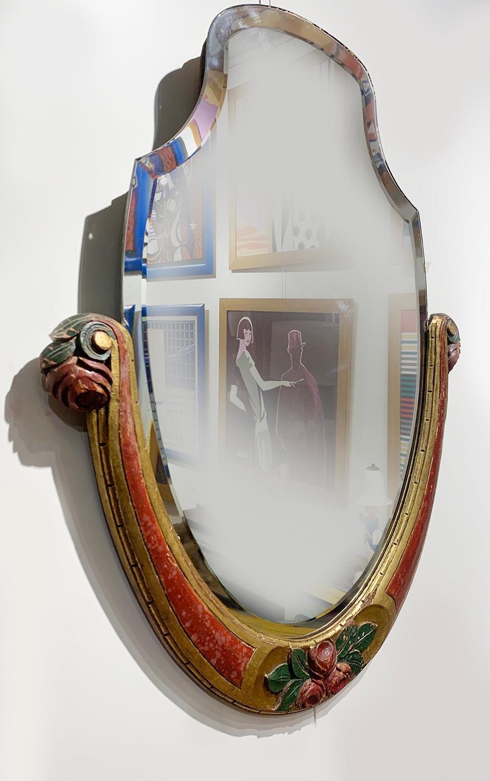 Colorful art Nouveau Mirror 
Having a hand carved wood frame with beveled mirror, circa 1920.