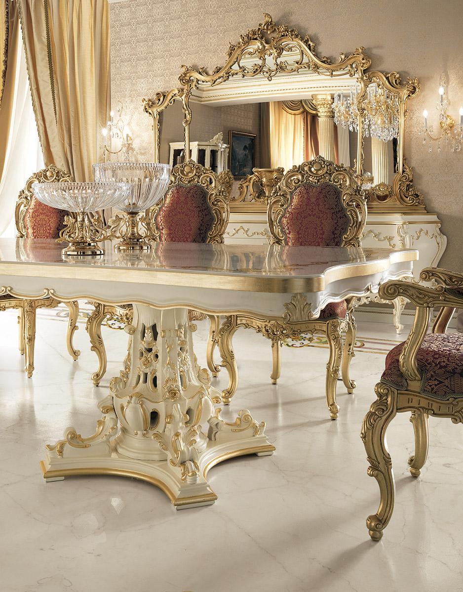 Refurnish your newbuilt mansion with a touch of monarchy by adding one of Modenese Interior's most sold baroque pieces. This dining chair features wide surfaces of hand-carved squiggle decorations completeley finished with gold-leaf applications,