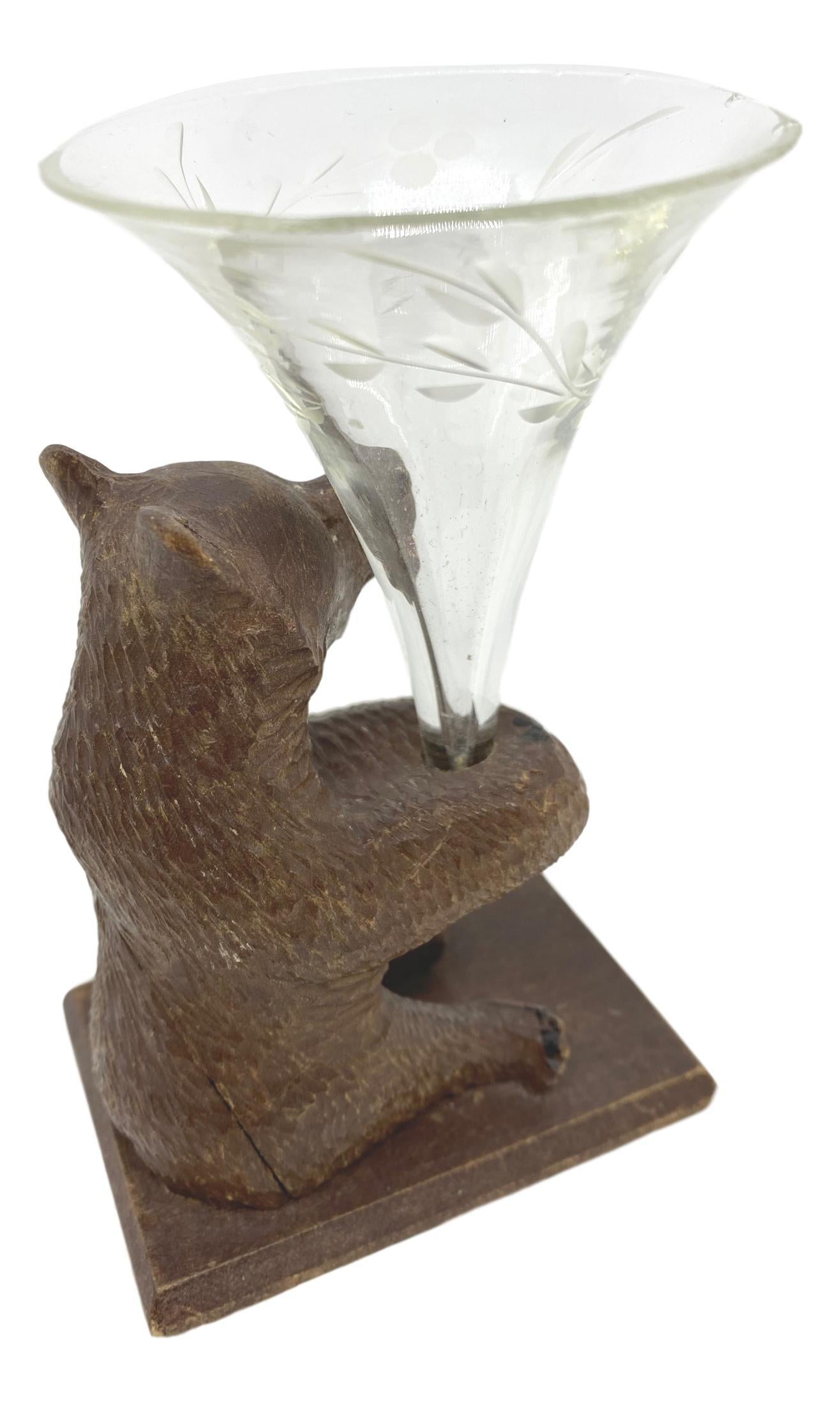 German Hand Carved Black Forest Brienz Wooden Bear with an Engraved Glass Vase or Flute For Sale
