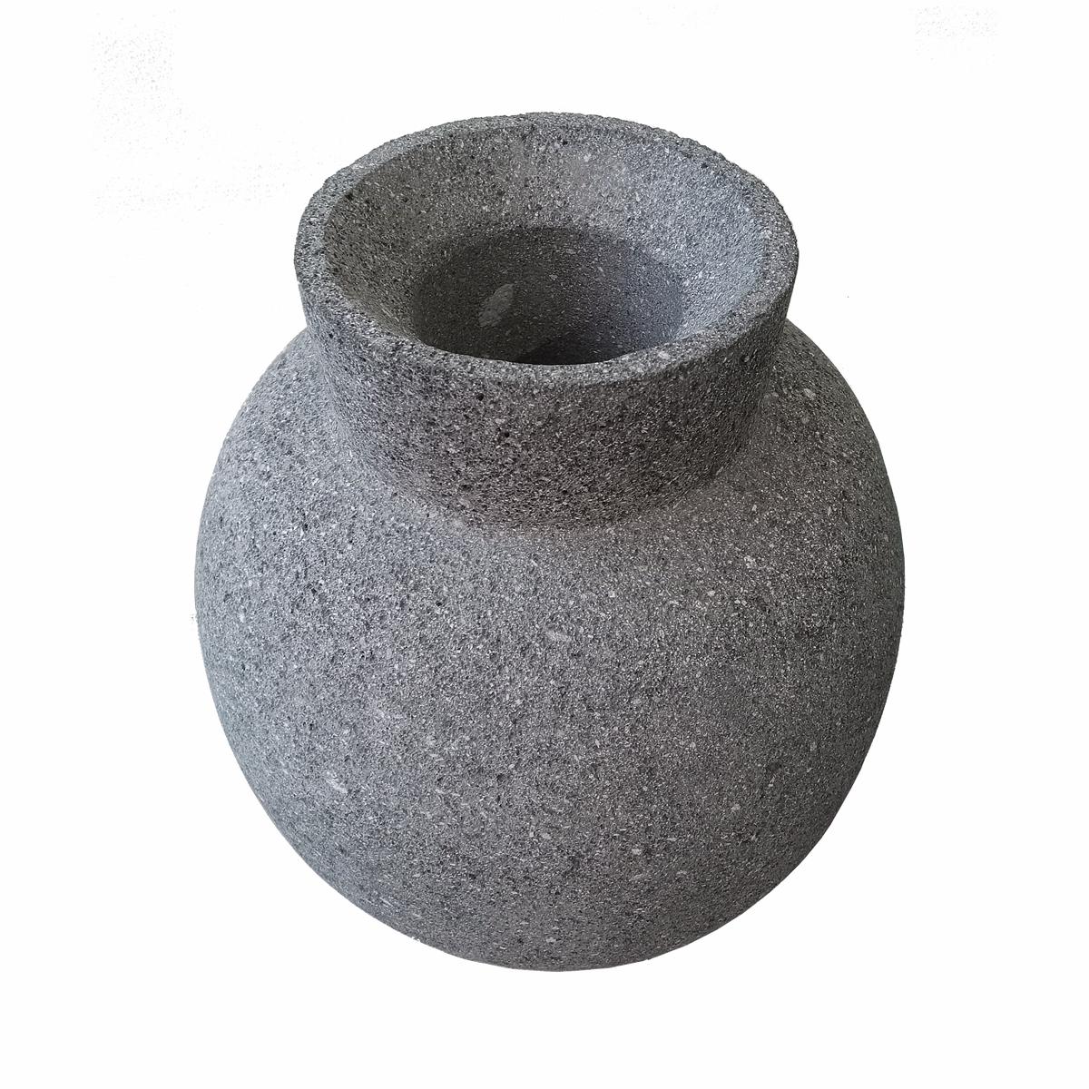 A dark lava stone vase or jar in an oval shape, and narrow top, hand-crafted in Mexico. An organic modern accent to home décor, in the kitchen, living room or any other area, indoors or outdoors. Its softly rounded edges make the rough texture of