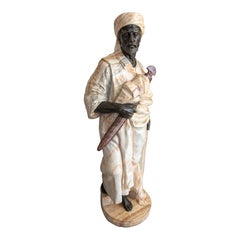 Escultura de guerrero nubio tallada a mano en mármol negro y ónice