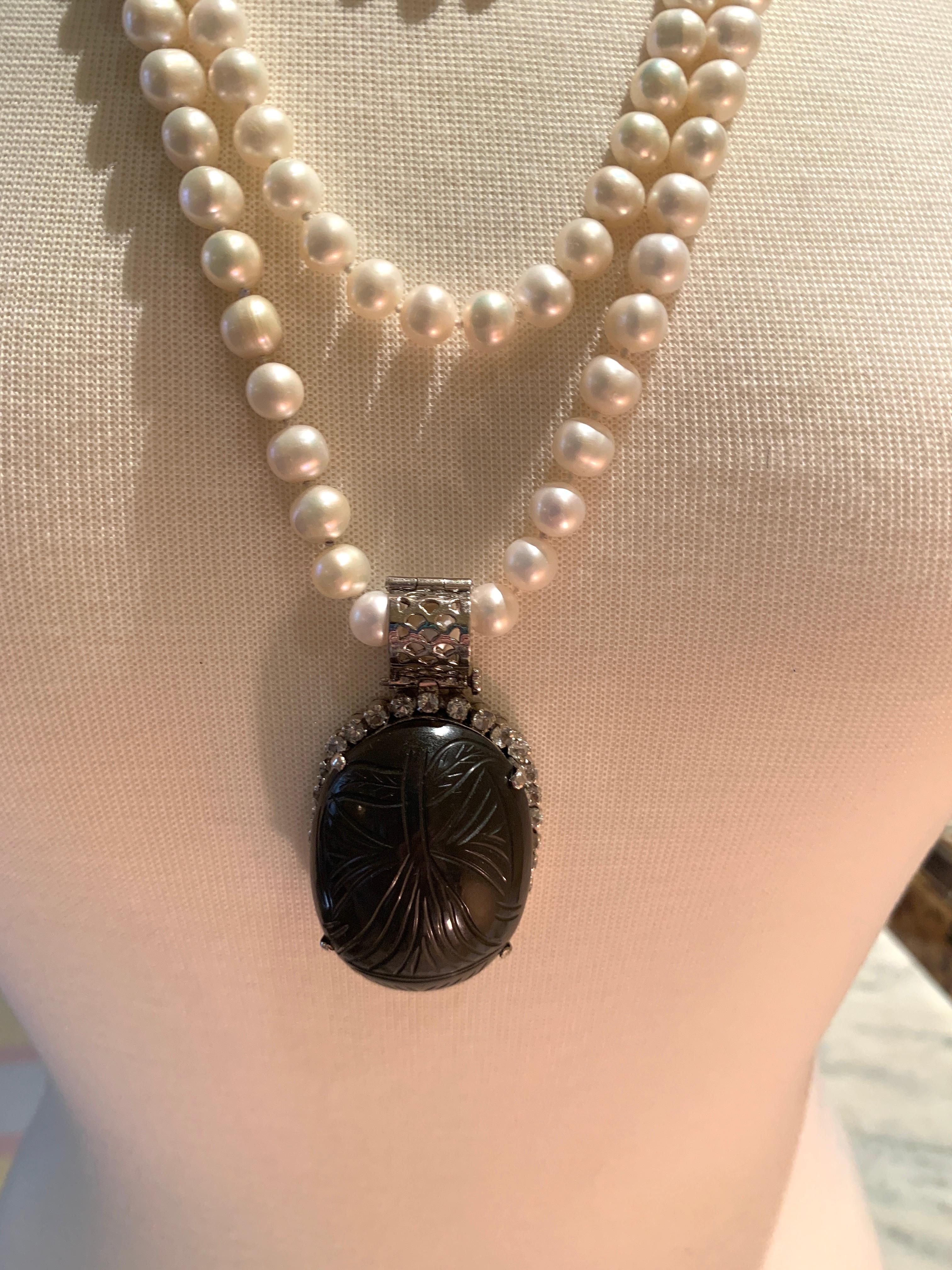 Artisan Hand Carved Black Obsidian Pendant with White Sapphires For Sale