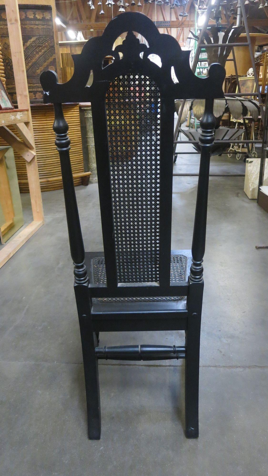 Victorian Hand Carved Oak Gothic Revival side throne chair with woven cane wicker back and seat.

Circa 1860.