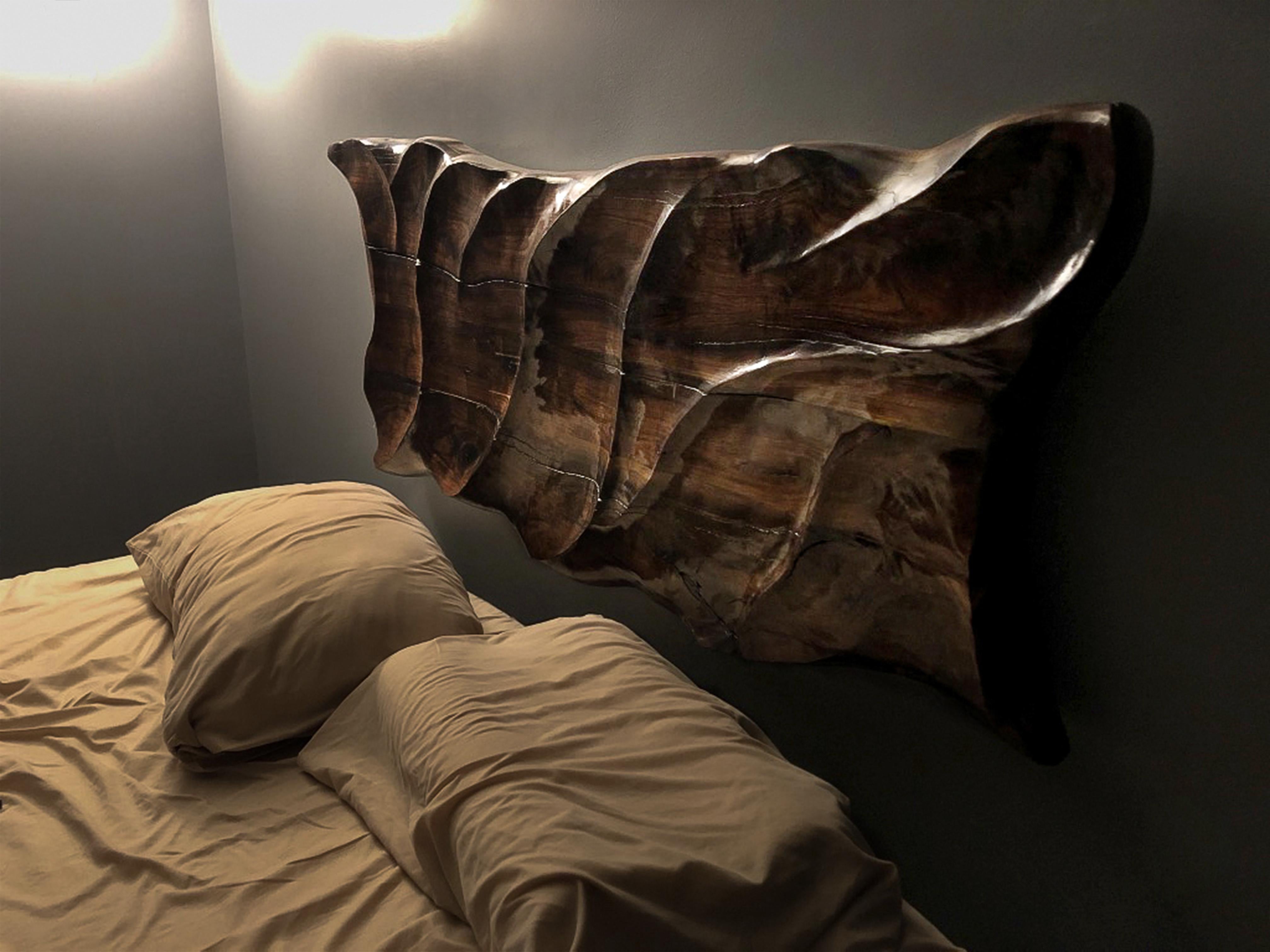 This hand-carved wall piece is made from five individual pieces of local-grown black walnut. Its gentle spines emulate the ripples on a calm lake, stream or pond. Intended for use as a headboard may also be used as decorative hanging art for a
