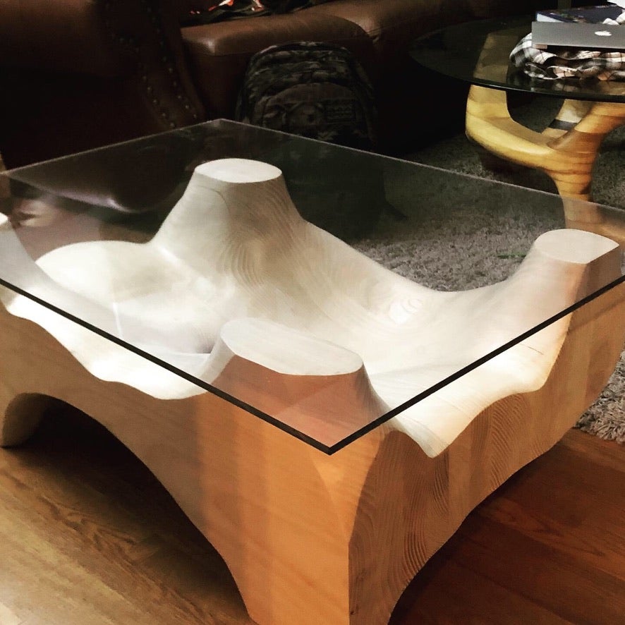 This hand-carved piece represents a cross-section of flowing viscosity permanently frozen into place seeking to perpetuate the sensation of movement in the eyes of the viewer. Carved from local white ash and bleached to achieve its desired hue while