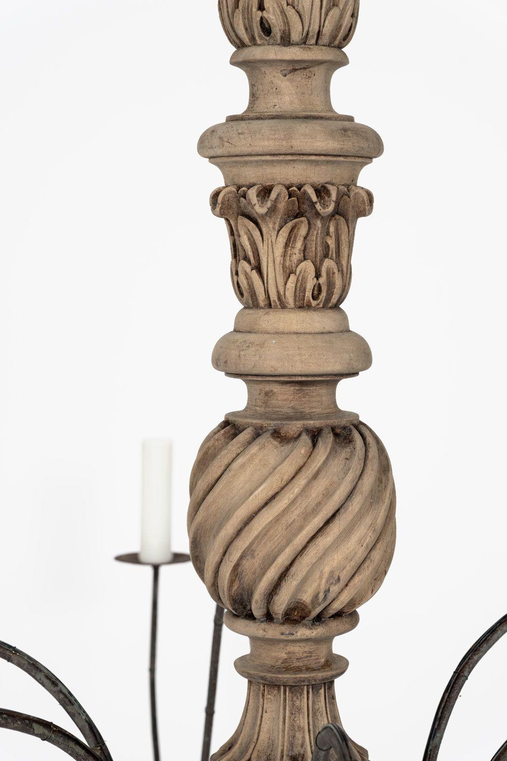 Hand-carved bleached wood French chandelier: chandelier hand-carved circa 1915-1935. Six iron arms. Newly-wired for use within the USA. Candelabra-sized sockets. Includes four feet of chain and its original canopy (listed height does not include