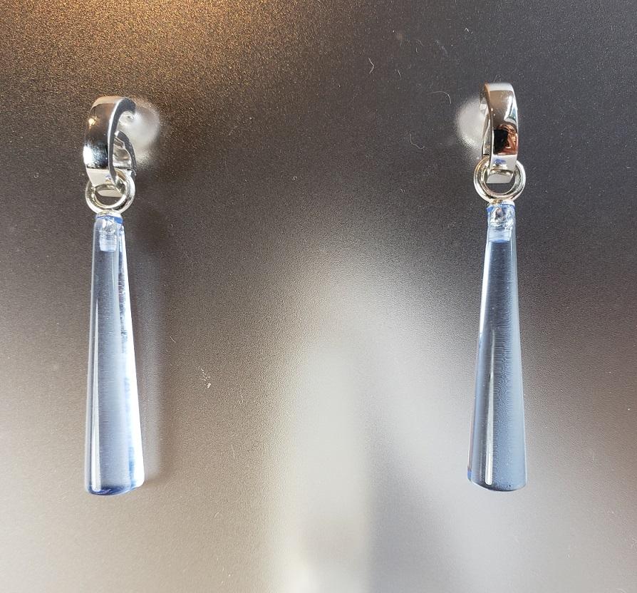 These elegant and sleek hand-carved blue quartz drops are flat on the back, and rounded on the top and bottom. They cutter polished these to a high shine but also has created a pair for me (and you) in a matte finish. They are set with sterling