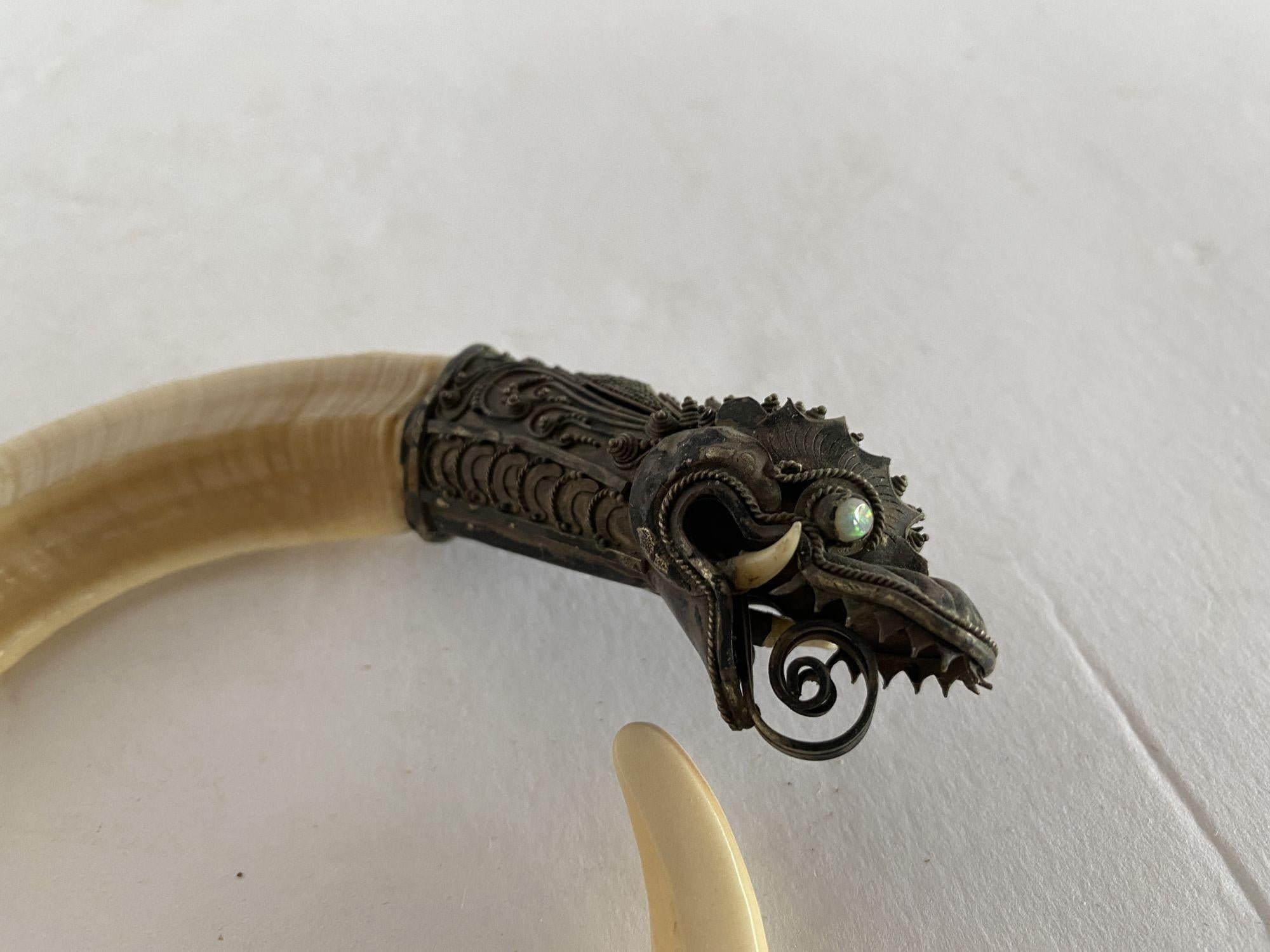 Late Victorian and carved bone and silver Chinese Oraborus bracelet.
 
circa 1800.