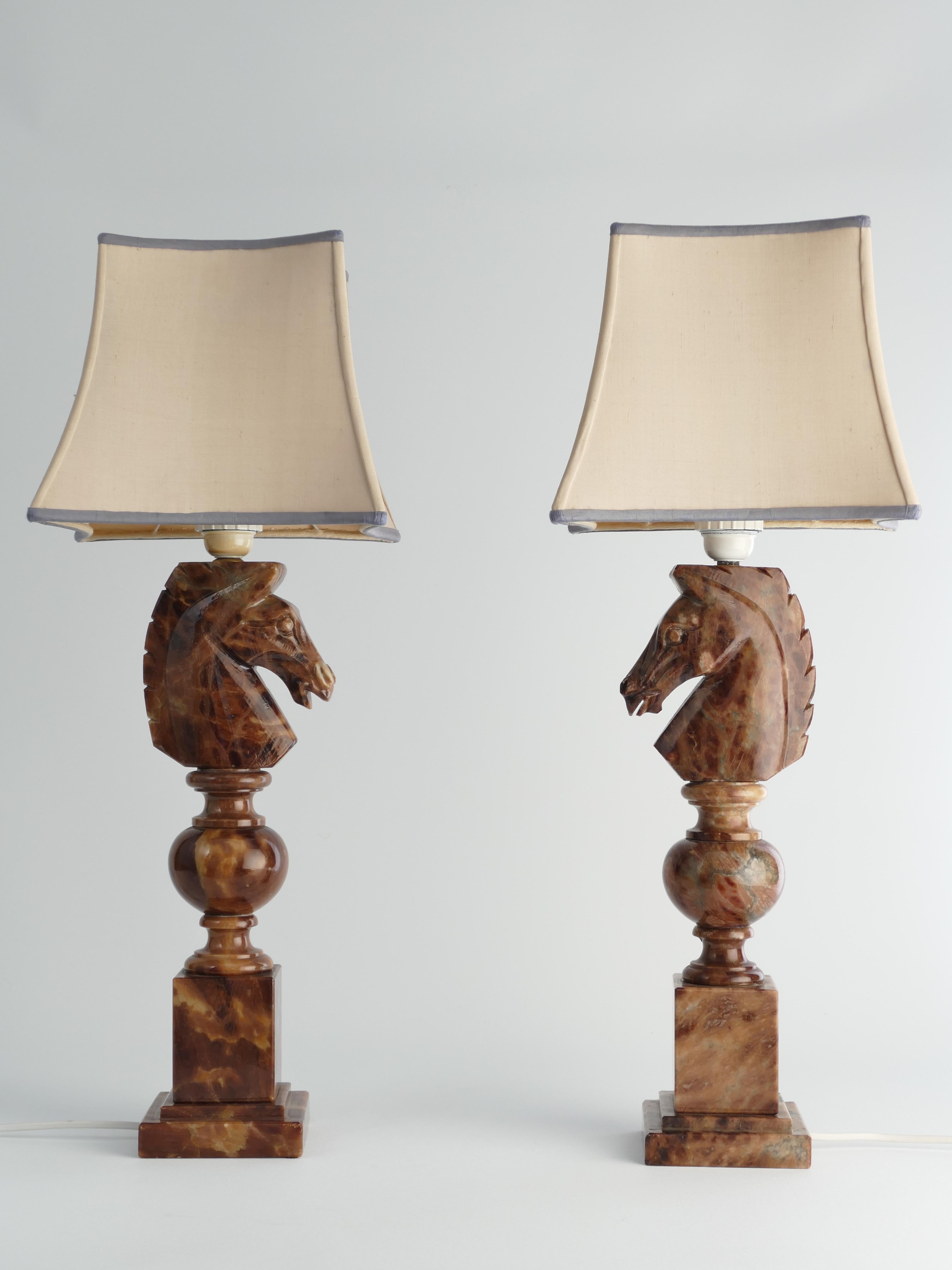 An astonishingly beautiful pair of Swedish-Italian hand-carved brown alabaster knight horse head table lamps, Nordiska Kompaniet, made in the 1970s.
The knight, an essential piece in the game of chess, is symbolized by a horse's head and neck,