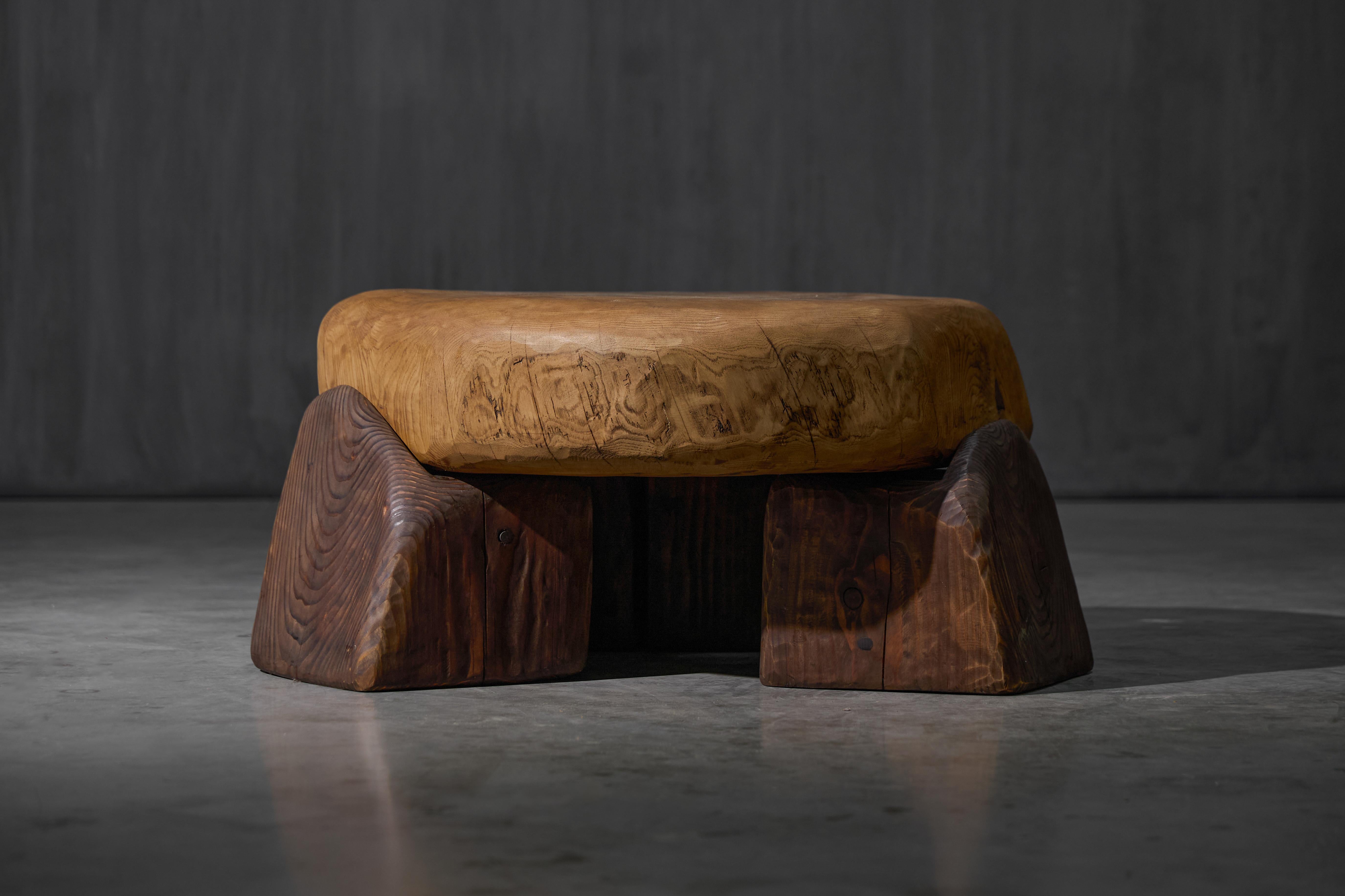 Crafted in 2025 from solid reclaimed wood, this small coffee table pairs a solid pine top with three hand-carved solid oak legs. The top is shaped with gentle curves and smooth edges, designed to sit freely on the base without attachment. Its