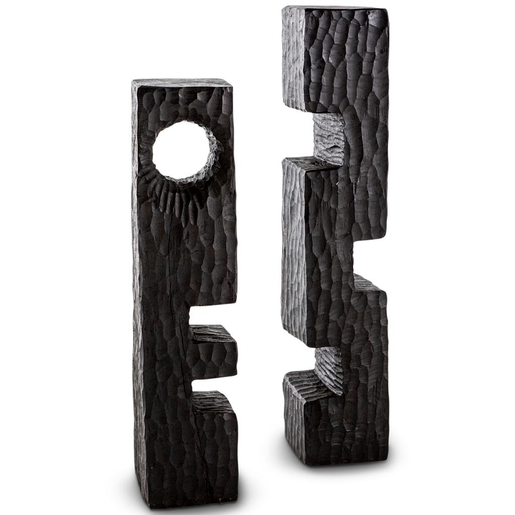 All our totem sculptures are hand-carved in Southern Africa from sustainable African alien timber by a group of Zimbabwean artists who set their own prices, thus making them fair trade. 

These sculptures have a strong African, primal and Brutalist