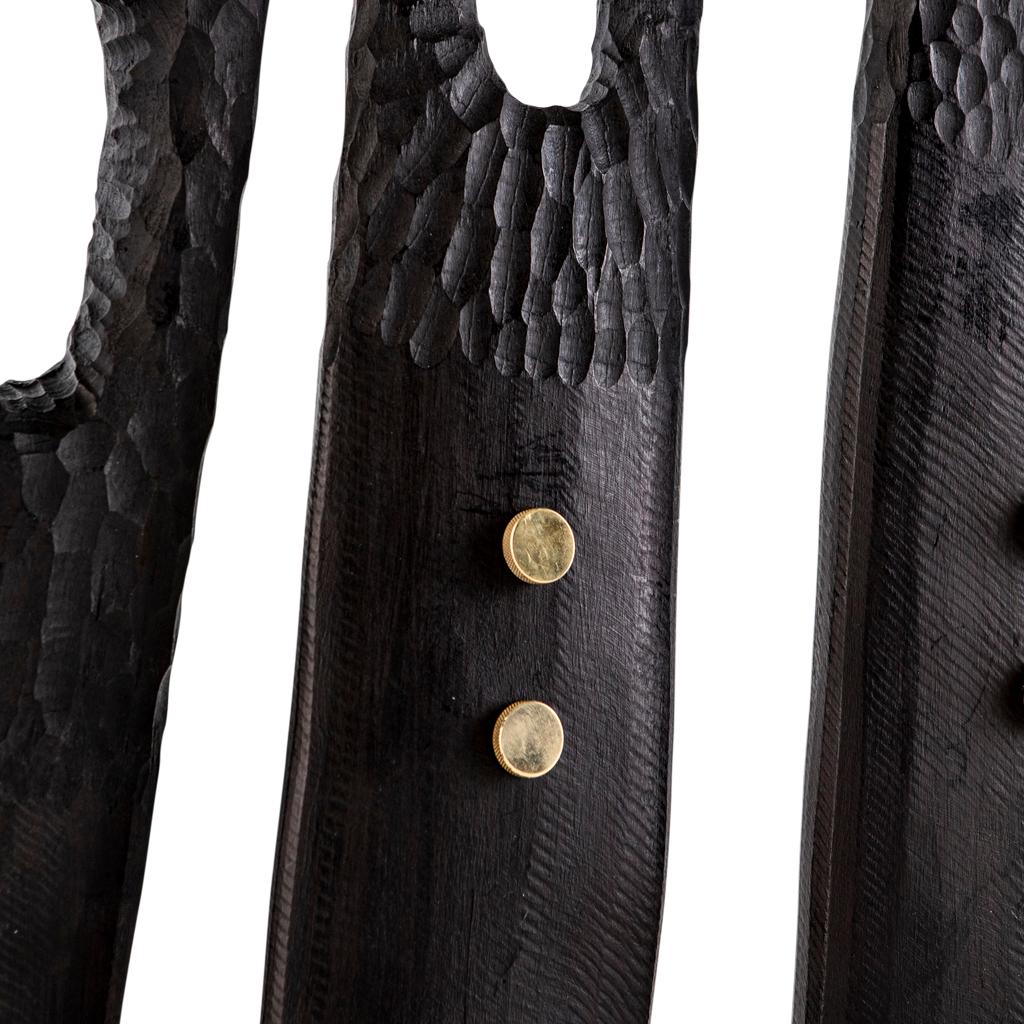 All our totem sculptures are hand-carved in Southern Africa from sustainable African alien timber by a group of Zimbabwean artists who set their own prices, thus making them fair trade. 

These sculptures have a strong African, primal and Brutalist