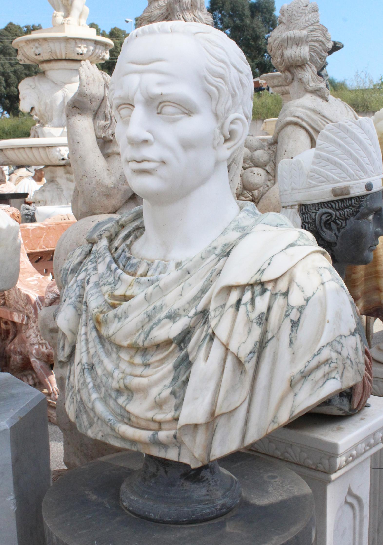 Hand-carved bust of Roman emperor Julius Caesar in different coloured marbles.