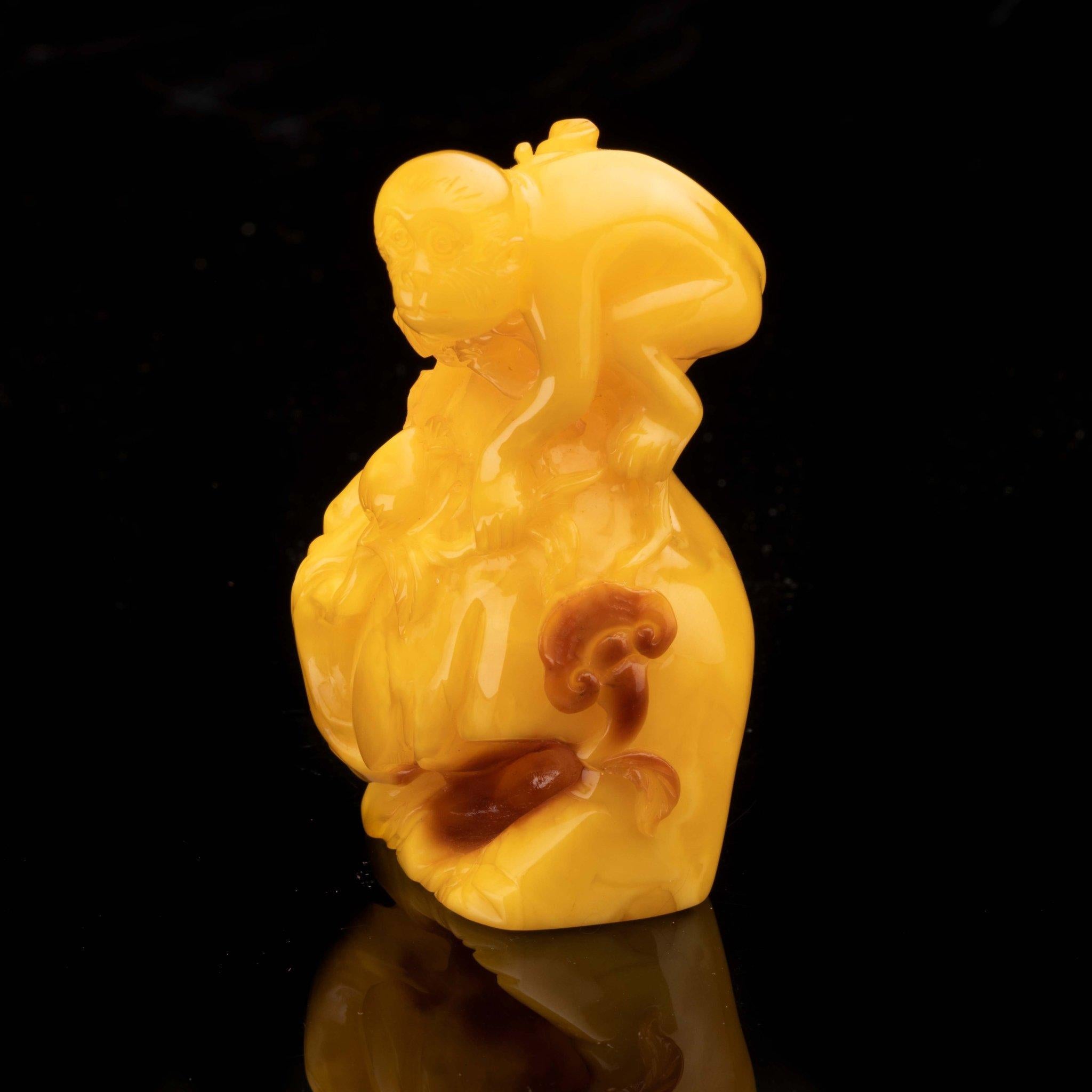 Ukrainian Hand-Carved Butterscotch Amber Monkey on Rock // 57.13 Grams For Sale