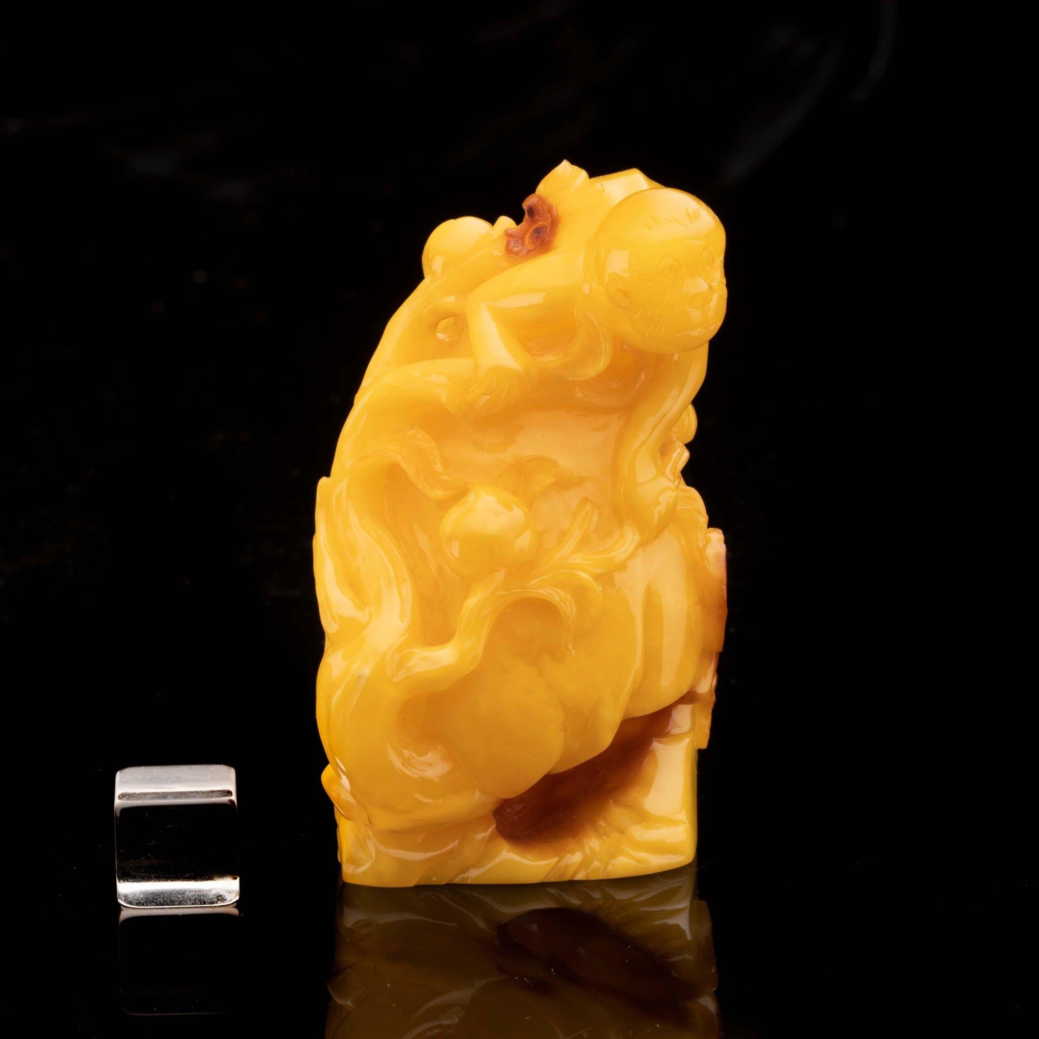 Hand-Carved Butterscotch Amber Monkey on Rock // 57.13 Grams In New Condition For Sale In New York, NY