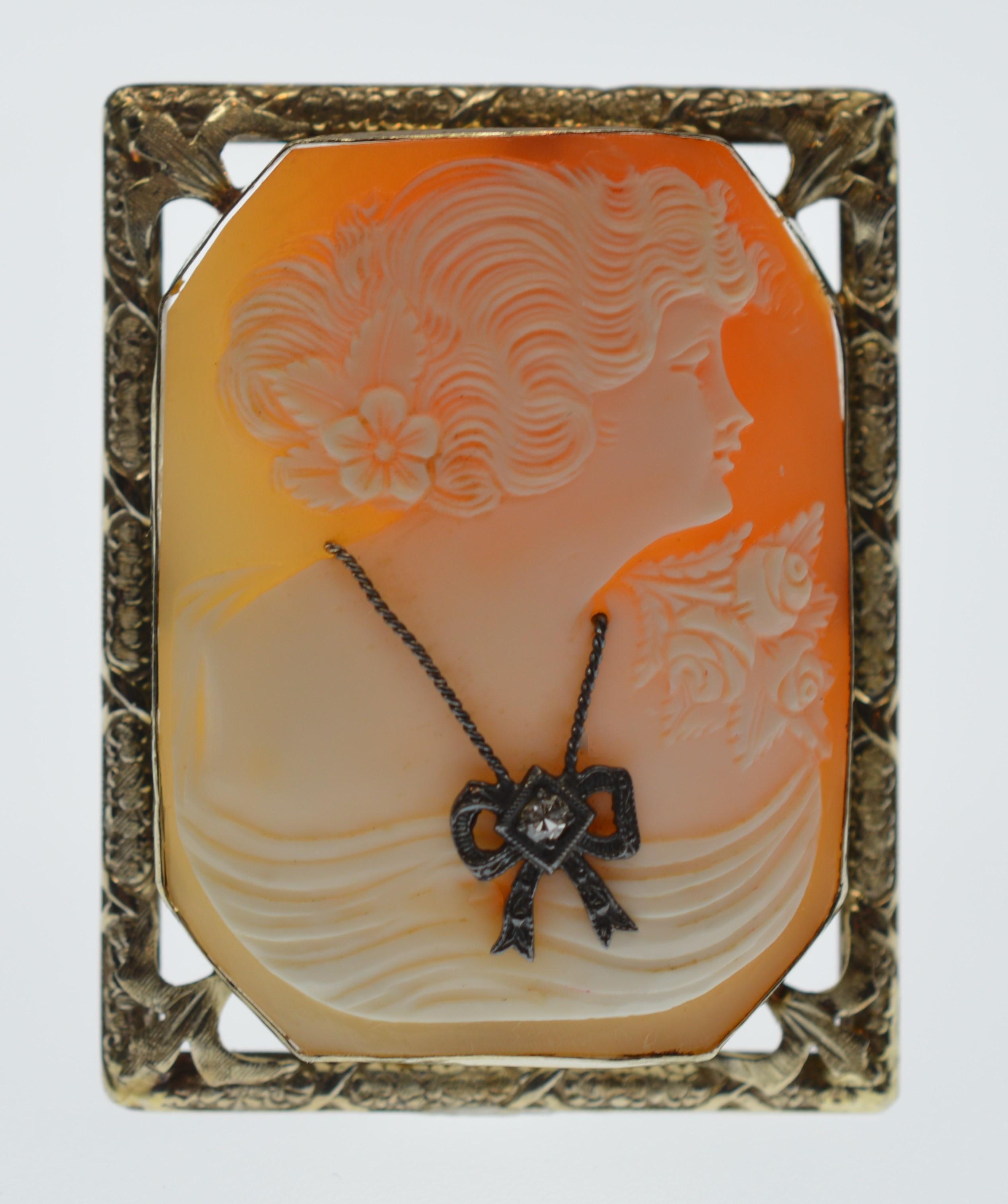 Unusually fine style hand carved Cameo Brooch Pin Pendant mounted in a 14 Karat Rose Gold frame. Created from a tropical mollusk by a European craftsman, this expertly carved raised relief image depicts the profile of a beautifully lady wearing a