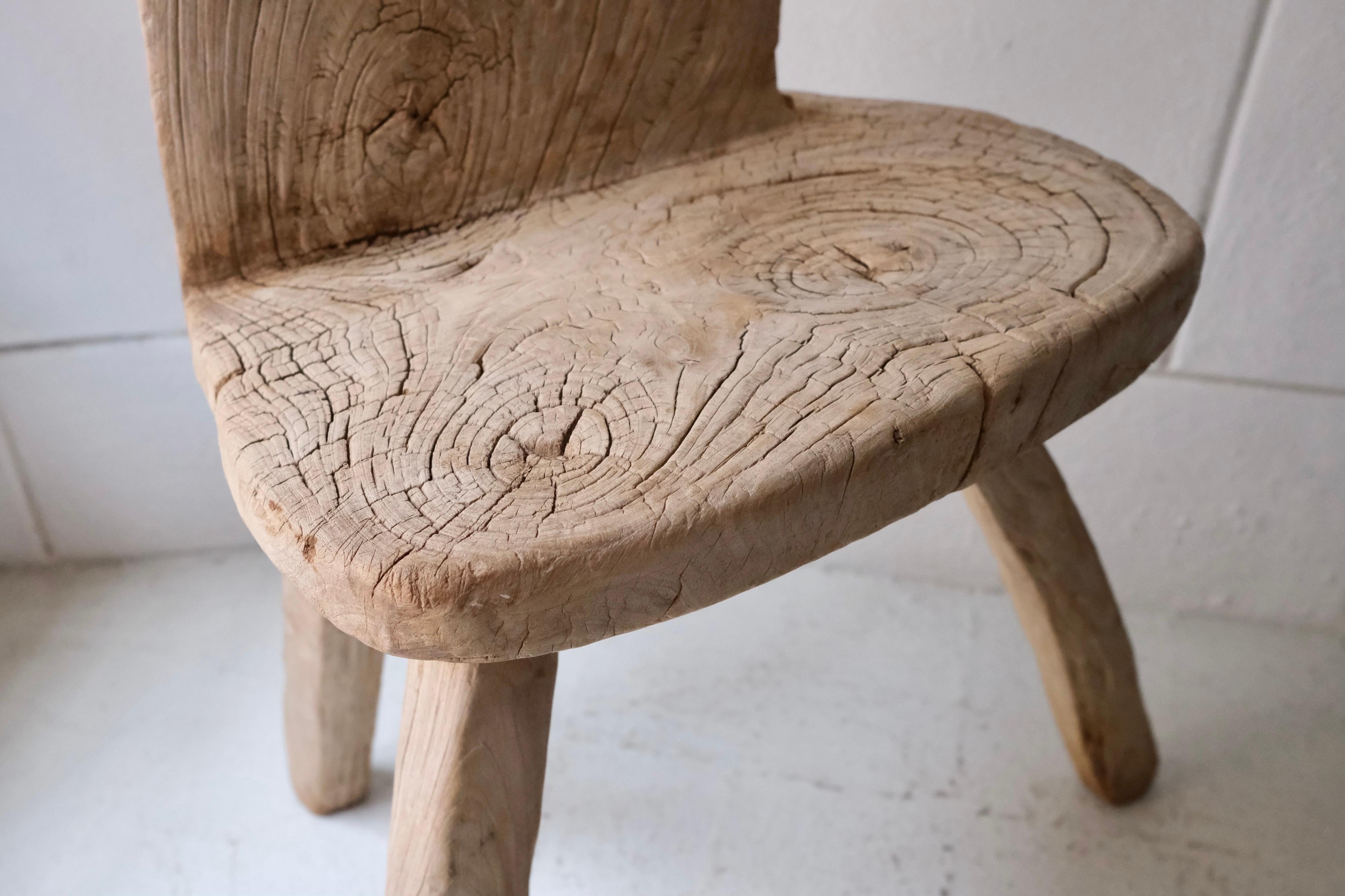 Rustic cedar chair hand carved in one piece, Ticul region, Yucatan, Mexico 1980's. One of a kind workmanship and finish.
