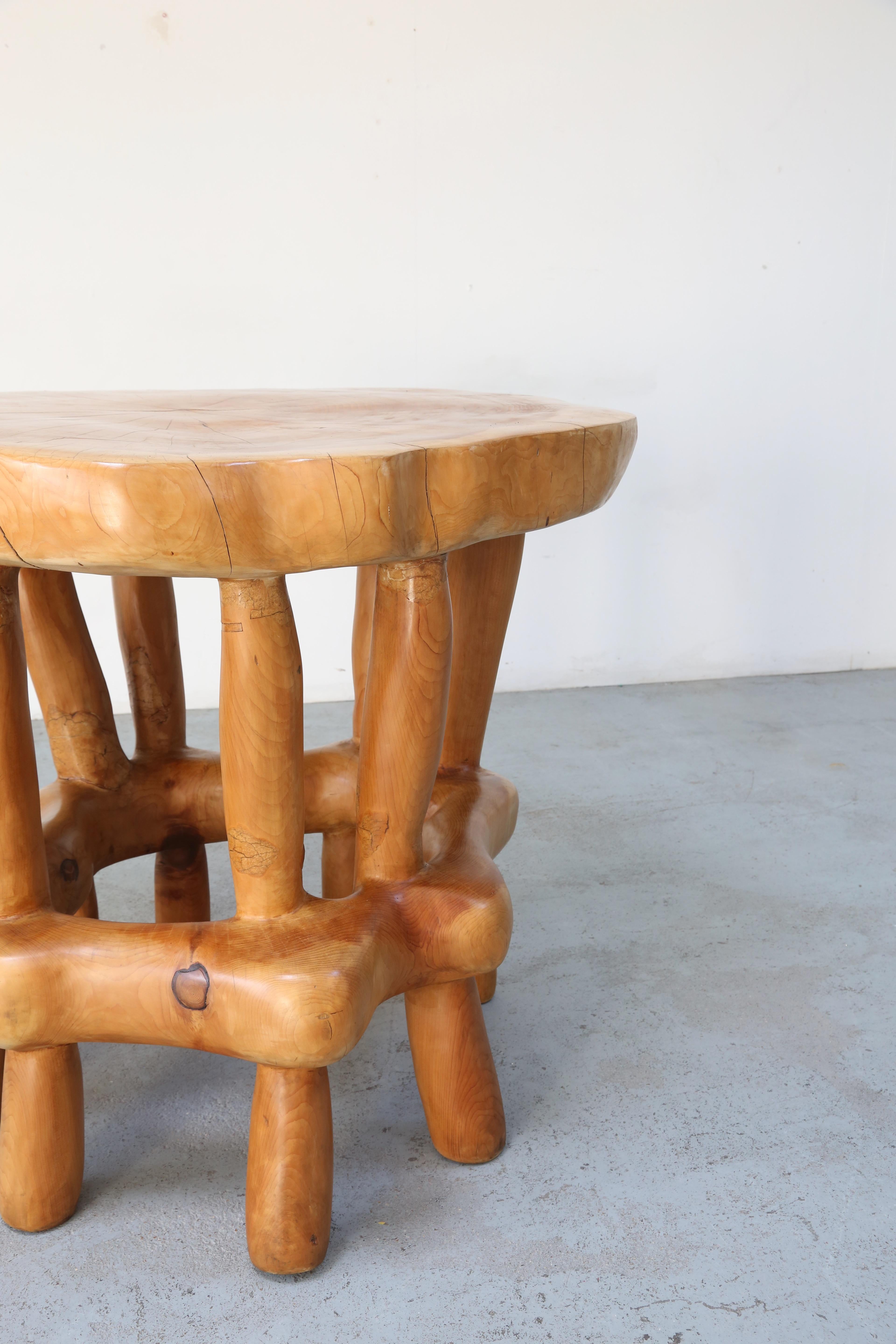 Huge statement centre table carved from the trunk of a huge douglas fir tree.

 Hand carved by the artist Maxie Lane (1910-2014)

 A larger than life character, also a well-known author, lumberjack and sculptor from Andover, Hampshire,