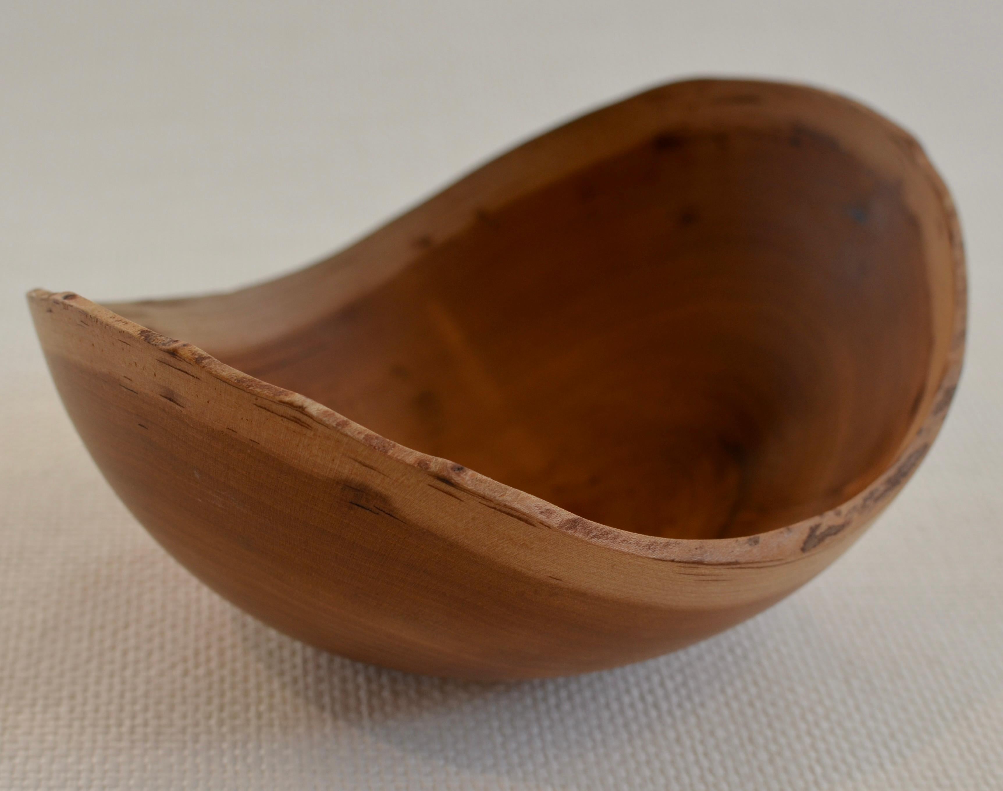 Hand-carved Cherry wood bowl with natural edge. Created using wood only from fallen Cherry trees. One of a kind.