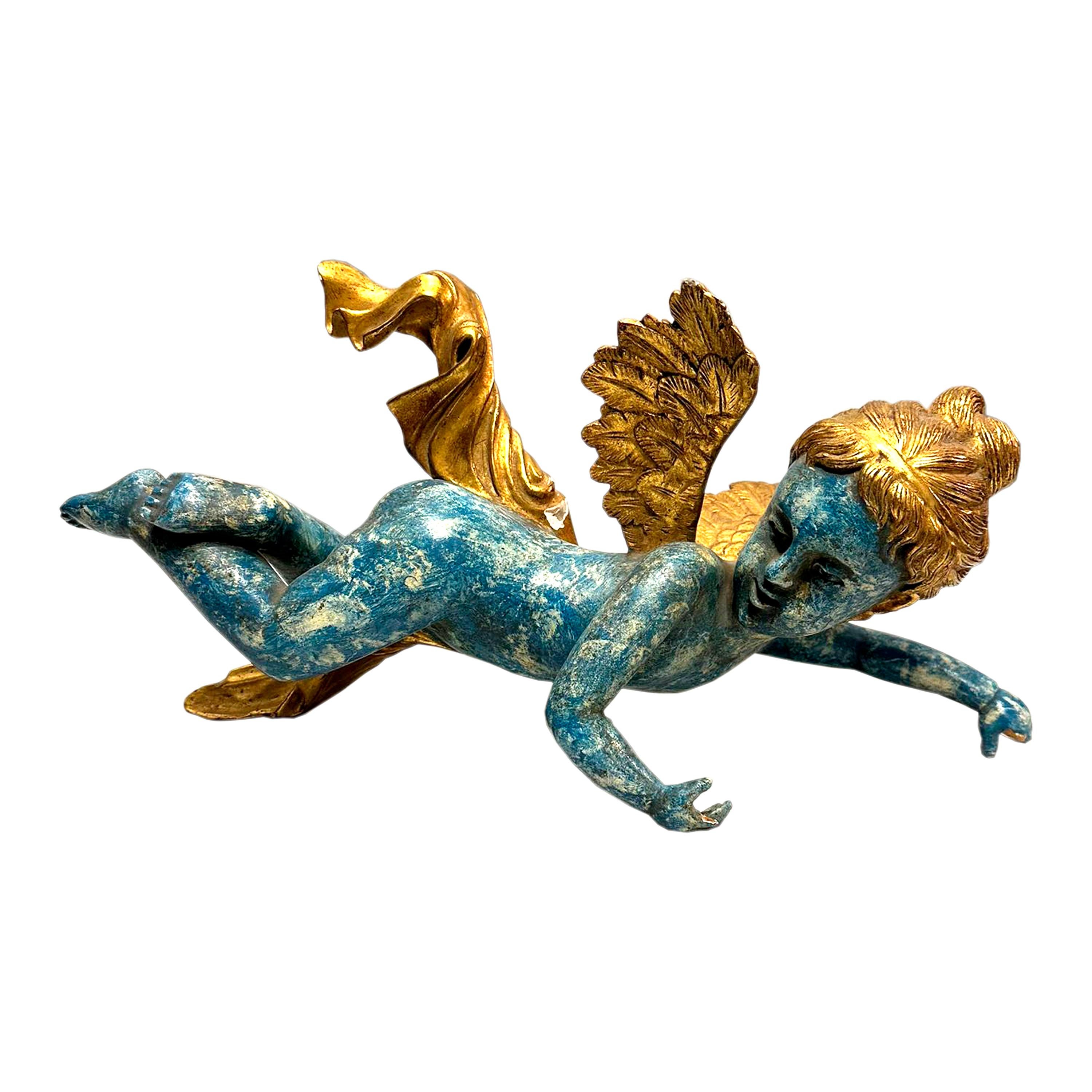 Pair of cherub sculptures in hand-carved and polychrome wood with gold leaf details. Italy 19th century.

