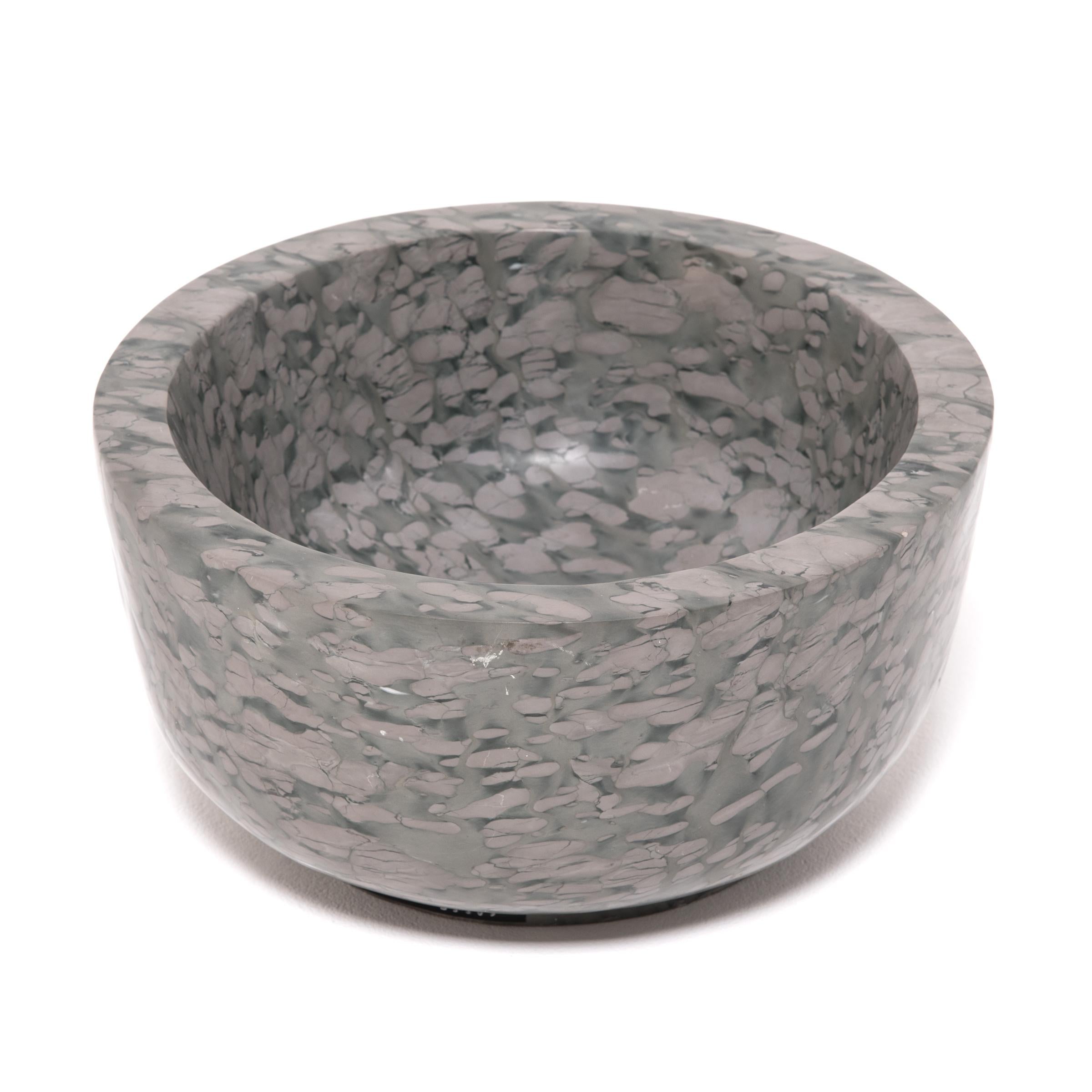 A clean-lined interpretation of an ancient form, this footed basin was hand-carved of zhenzhu stone by artisans in China's Shandong province. The mesmerizing pattern of zhenzhu is inherent to the stone, a conglomerate limestone extracted from Lake