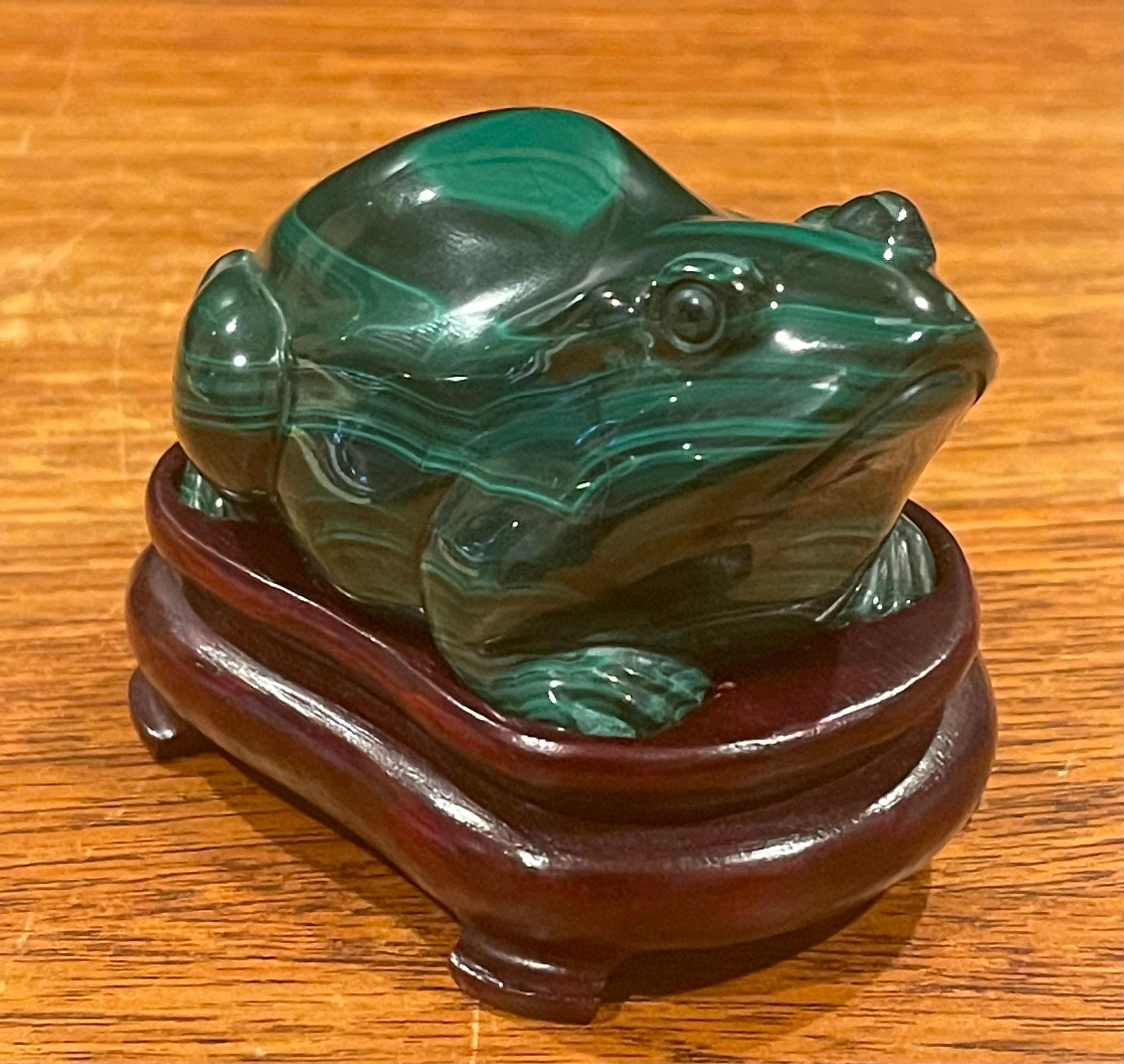 A very cool hand carved malachite frog / toad sculpture on fitted hardwood base, circa 1970s. The piece is a superb example of traditional Chinese hardstone figural carving; it is very well detailed and highly polshed. The frog is in very good
