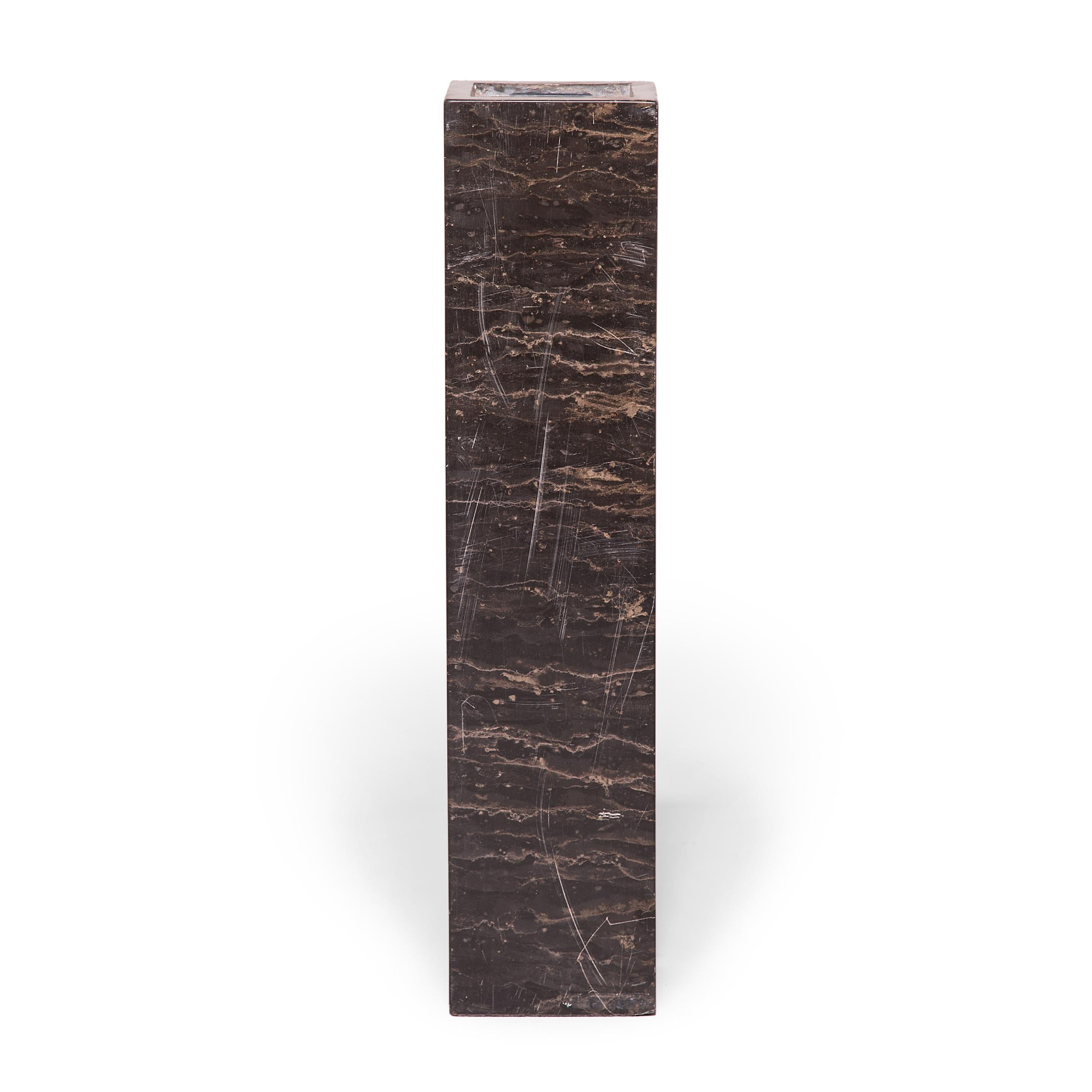 Displaying the restraint and simplicity that defined Ming dynasty design, this hand-carved marble column can find a home in any room. Natural striations in the marble are accentuated by the column's clean lines, allowing the beauty of the stone to