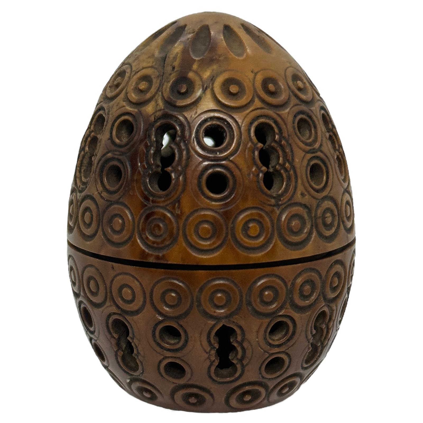 A beautiful hand carved coquille nut egg box. Beautiful carving, great patina, unscrews at center to open.
The original use was a flea trap, things were different in the old days and pesticides were not available.
So some stuff just flourished,