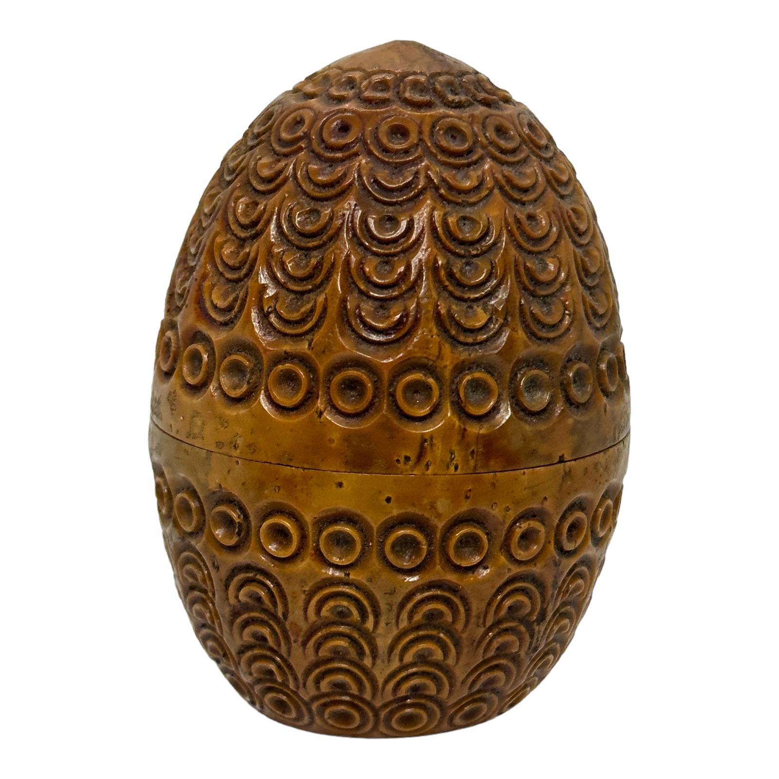 A beautiful hand carved coquille nut egg box. Beautiful carving, great patina, unscrews at center to open.
The original use was a flea trap, things were different in the old days and pesticides were not available.
So some stuff just flourished,