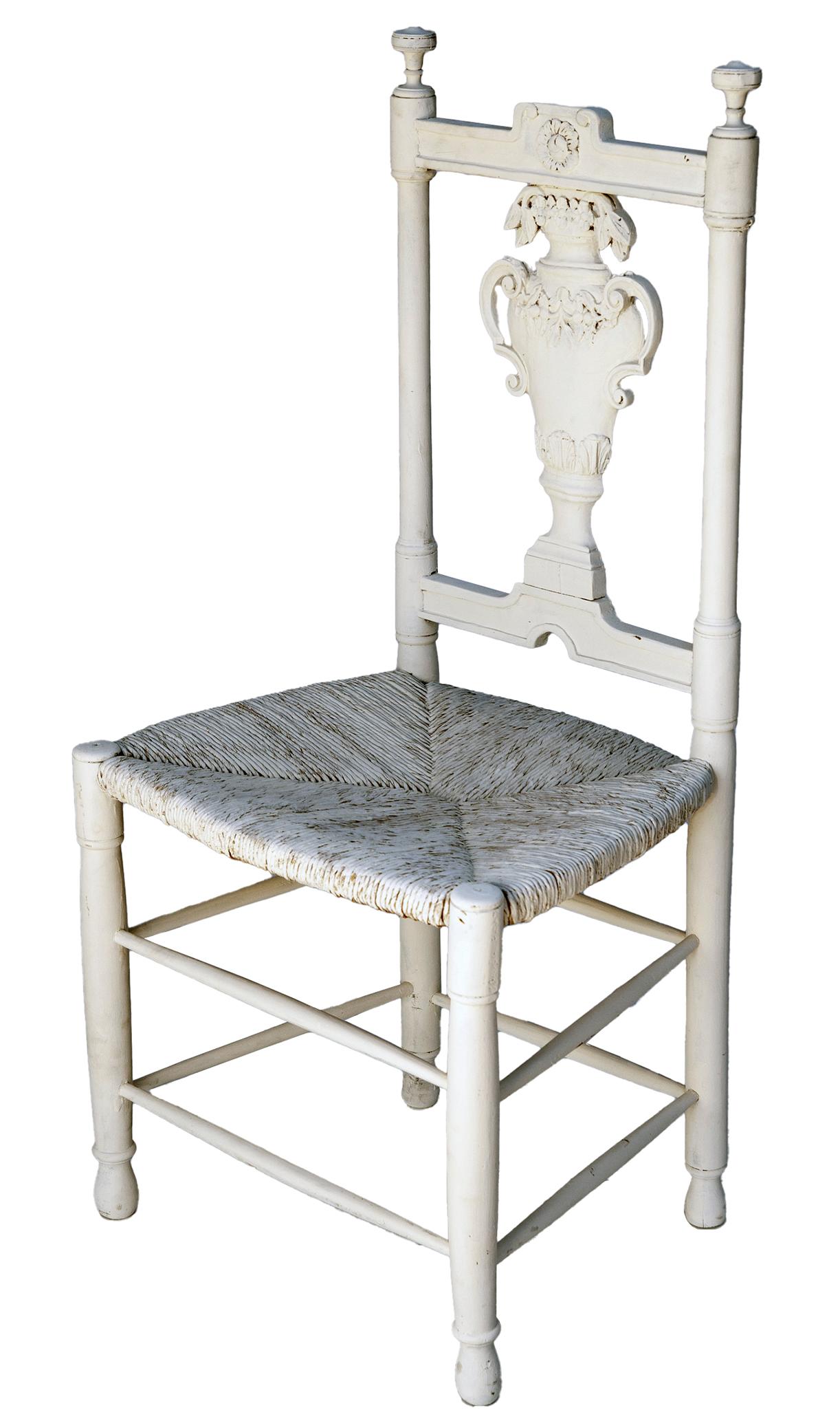 Handcarved Country French side chair or desk chair with rush seat. The chair is sturdy and upright. The carving on the back is of highly decorated urn.
Freshly hand painted seat and back.