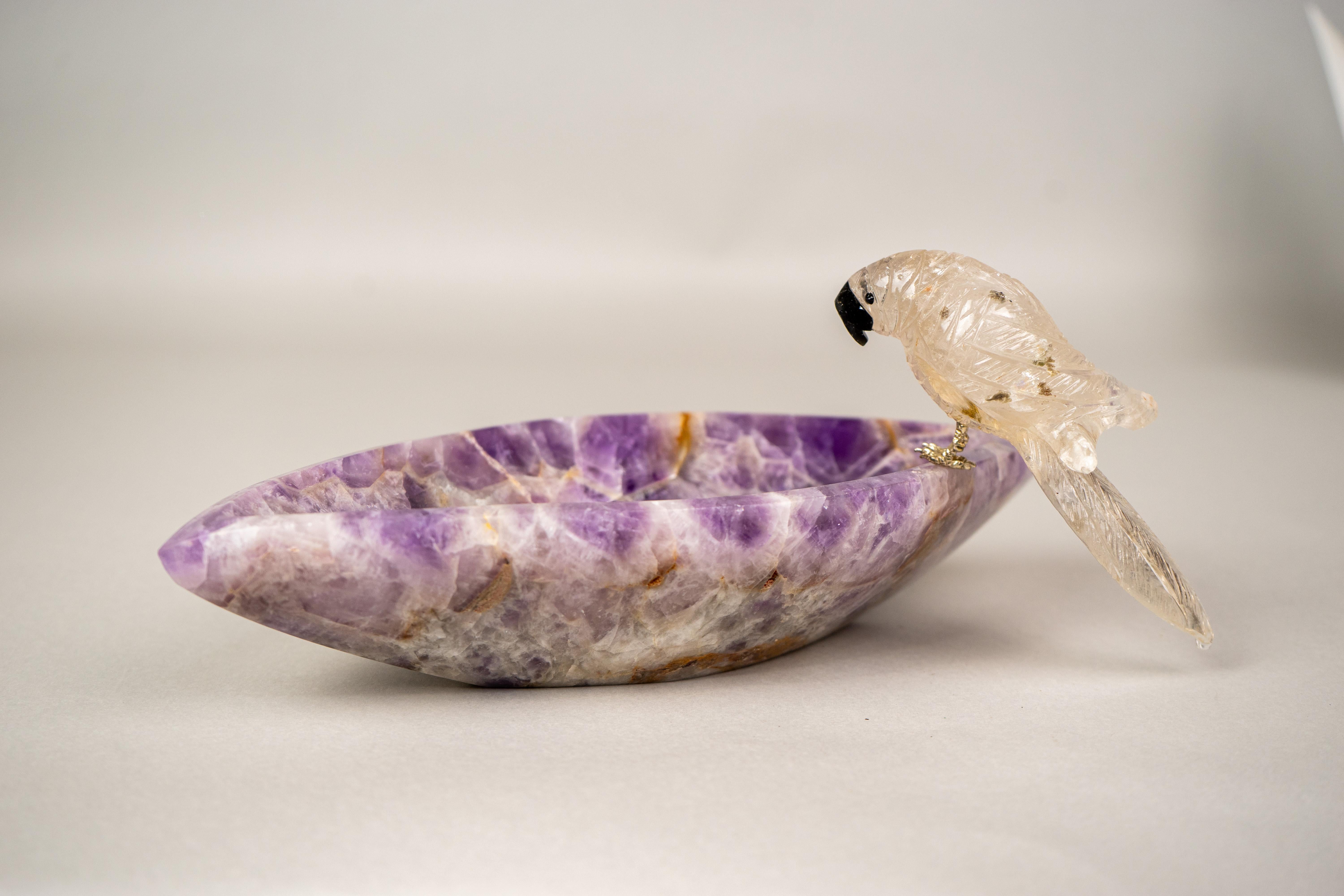 Delicate Crystal Parrot Set on a Chevron Amethyst Quartz Bowl

▫️ Description

Depicting a tranquil Brazilian parrot, this hand-carved bowl draws inspiration from the country’s rich fauna and is crafted exclusively from the finest Brazilian chevron